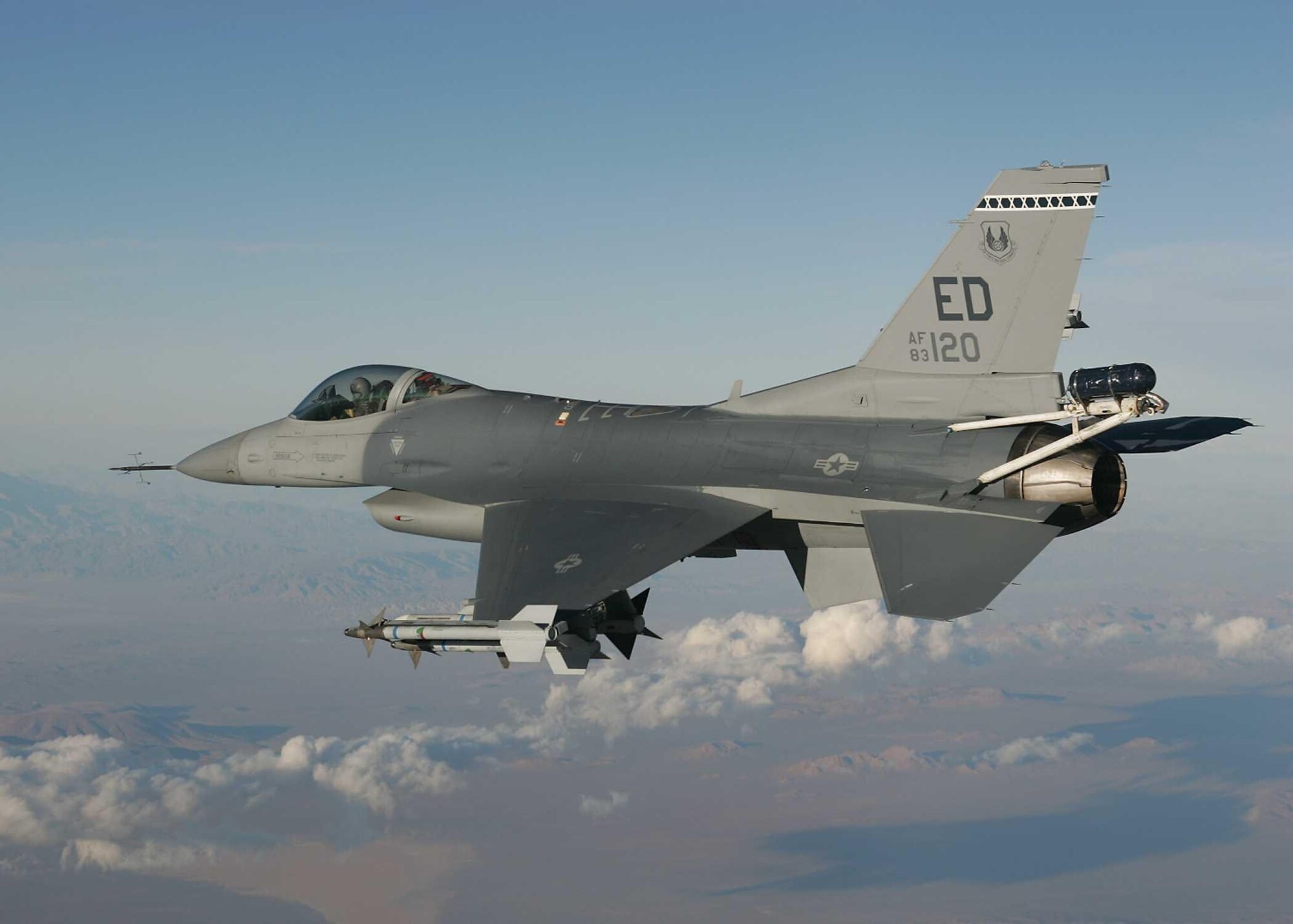 EDWARDS AIR FORCE BASE, Calif. — An F-16 from the 416th Flight Test Squadron tests a replacement pylon designed to carry towed decoys for the Taiwan air force. The Taiwan High Angle of Attack program was rolled into Edwards’ Operational Readiness Exercise, Feb. 27 through March 3, to prove the squadron’s capability to “test surge” in support of real-world Global War on Terror requirements. (Air Force photo by Tom Reynolds)

