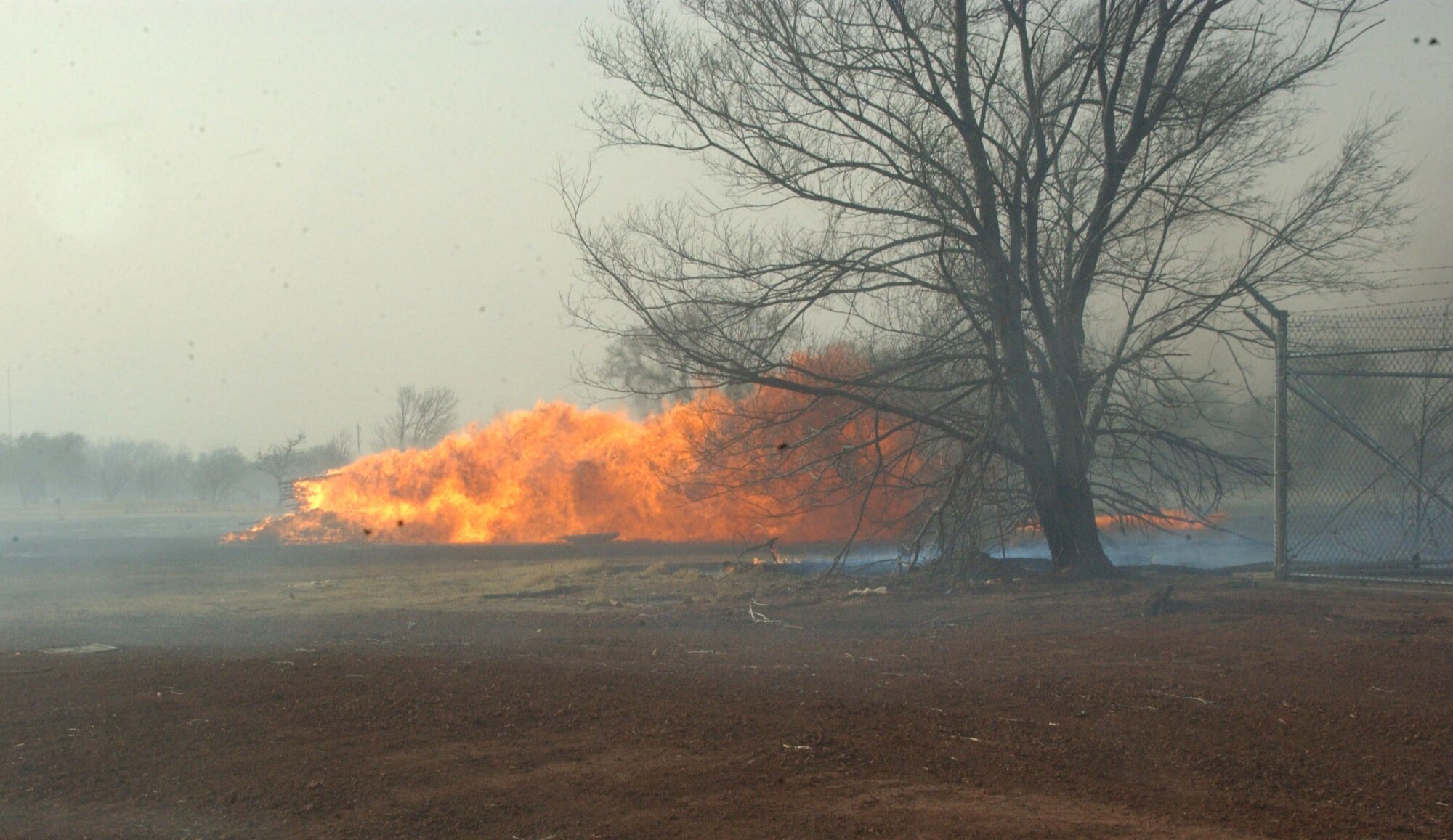A fire burns outside the south entrance gate at Altus Air Force Base, Okla., Sunday, March 12. The fire eventually made its way on base. No injuries were reported. (Courtesy photo) 

