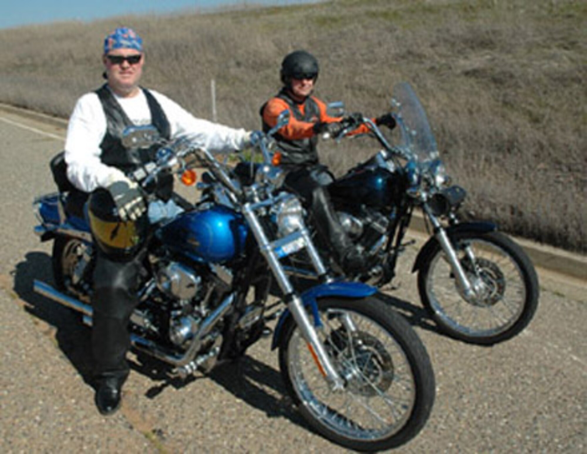 Col. James Kerr, 940th Air Refueling Wing commander, and Lt. Col. Lew Harding, 940 ARW Chief of Safety, prepare for a afternoon ride. They will be participating in a wing motorcycle rally March 11. (U.S. Air Force photo by Maj. Robert Couse-Baker) 