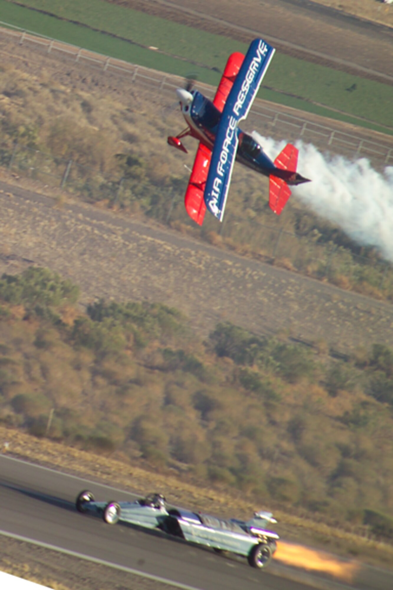 Ed Hamill, an F-16 pilot with the U.S. Air Force Reserve, races the "Smoke and Thunder" Jet Car at an air show. Hamill is a member of the 301st Fighter Squadron at Luke Air Force Base, Ariz. (U.S. Air Force photo)