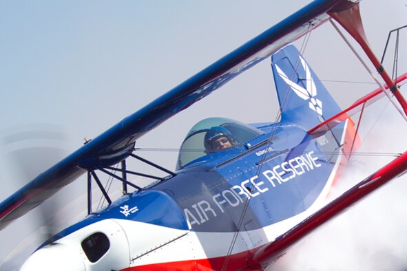 Ed Hamill, a member of the 301st Fighter Squadron, flies the "Dream Machine" at an air show. The "Dream Machine" biplane design is based on a 1950 blueprint. The wings and tail are fabric-covered just like the barnstormers' planes of the 1920s. The aircraft weighs approximately 1,300 pounds and can hit aerobatic flight load limits of more than six Gs and negative five Gs. (U.S. Air Force photo)