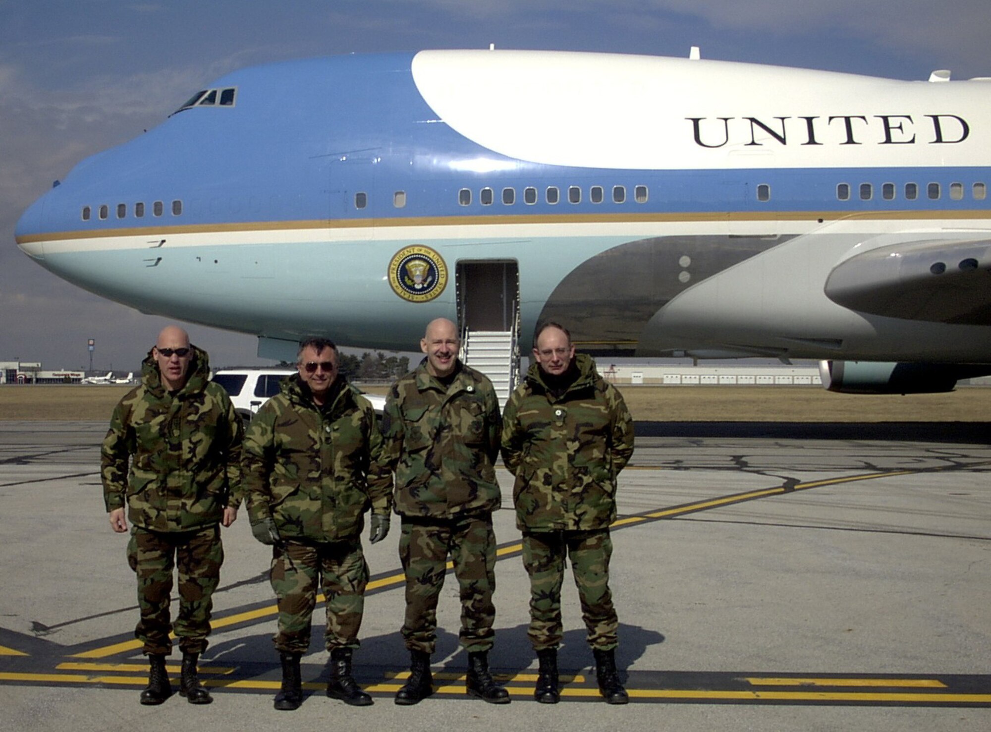 Grissom Air Reserve Base, Ind.,--- Members of the 434th Maintenance Group and 434th Logistics Readiness Squadron traveled to South Bend, Ind., to provide support to Air Force One during a presidential visit.  Pictured in front of Air Force One are (left to right) Staff Sgt. Roy Murphy, Technical Sgt. Larry Pierce, Master Sgt. Kevin Pitzer and Master Sgt. Duane Border. Not shown are Technical Sgt. Ray Butler and Technical Sgt. Dave Fisher.  