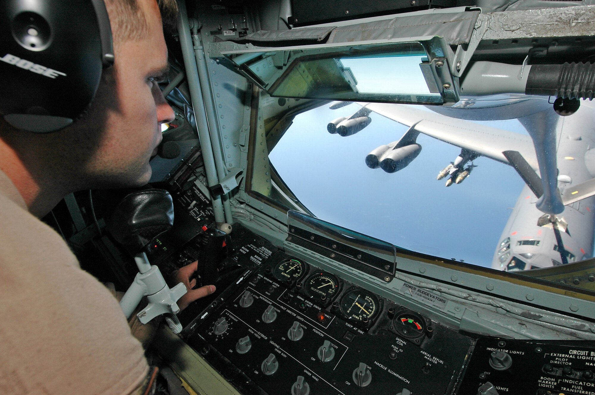 Airman 1st Class Ben Davis refuels a B-52 Stratofortress bomber from a KC-135 Stratotanker, Monday, March 13, 2006, during a mission in support of Operation Enduring Freedom. The B-52 provides close air support for ground troops in Afghanistan. Davis is a boom operator assigned to the 28th Expeditionary Air Refueling Squadron. (U.S. Air Force photo/Staff Sgt. Douglas Nicodemus)