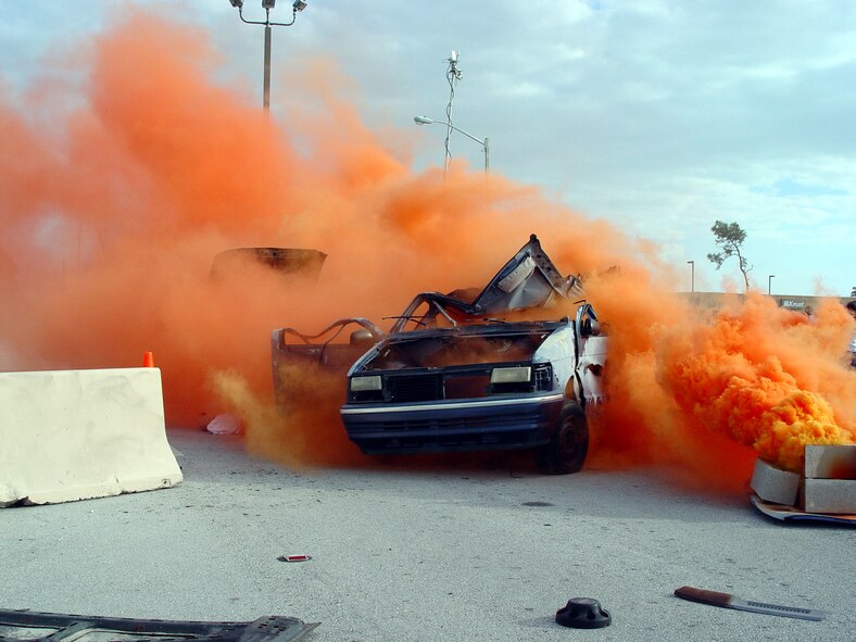 Smoke fills the air as a simulated car bombing just outside the main gate of Homestead Air Reserve Base begins a mass casualty exercise on March 14.  The exercise tested the 482nd Fighter Wing's ability to respond to a terrorist attack on the base (U.S. Air Force Reserve photo by Lisa Macias).  