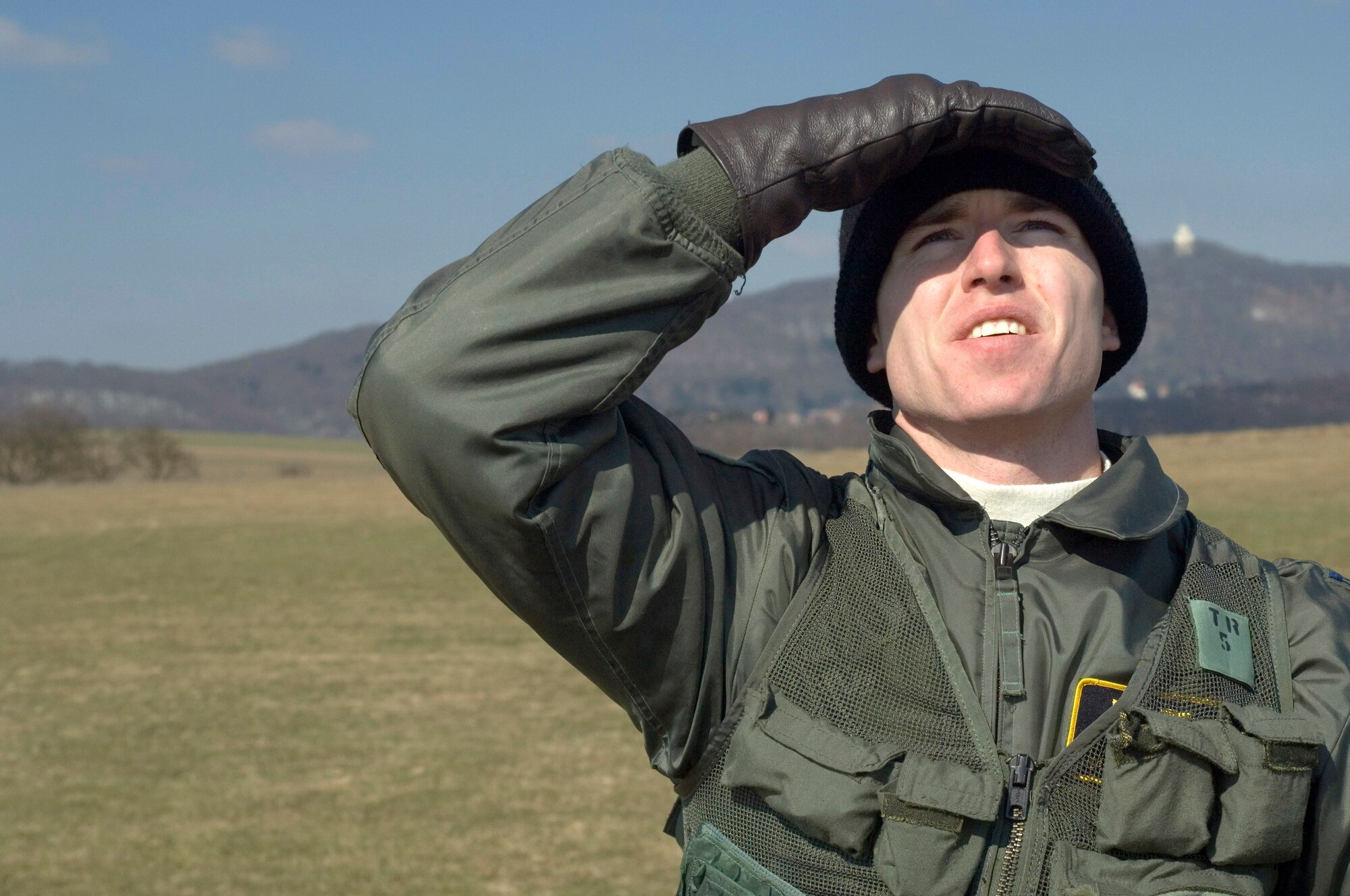 Capt. Doug Galloway scans the sky for an A-10 Thunderbolt II during combat search and rescue training at Marpingen, Germany, Monday, March 13, 2006.  Captain Galloway is an A-10 fighter pilot from Fort Walton Beach, Fla., with the 81st Fighter Squadron at Spangdahlem Air Base, Germany.   (U.S. Air Force photo/Master Sgt. John Lasky)
