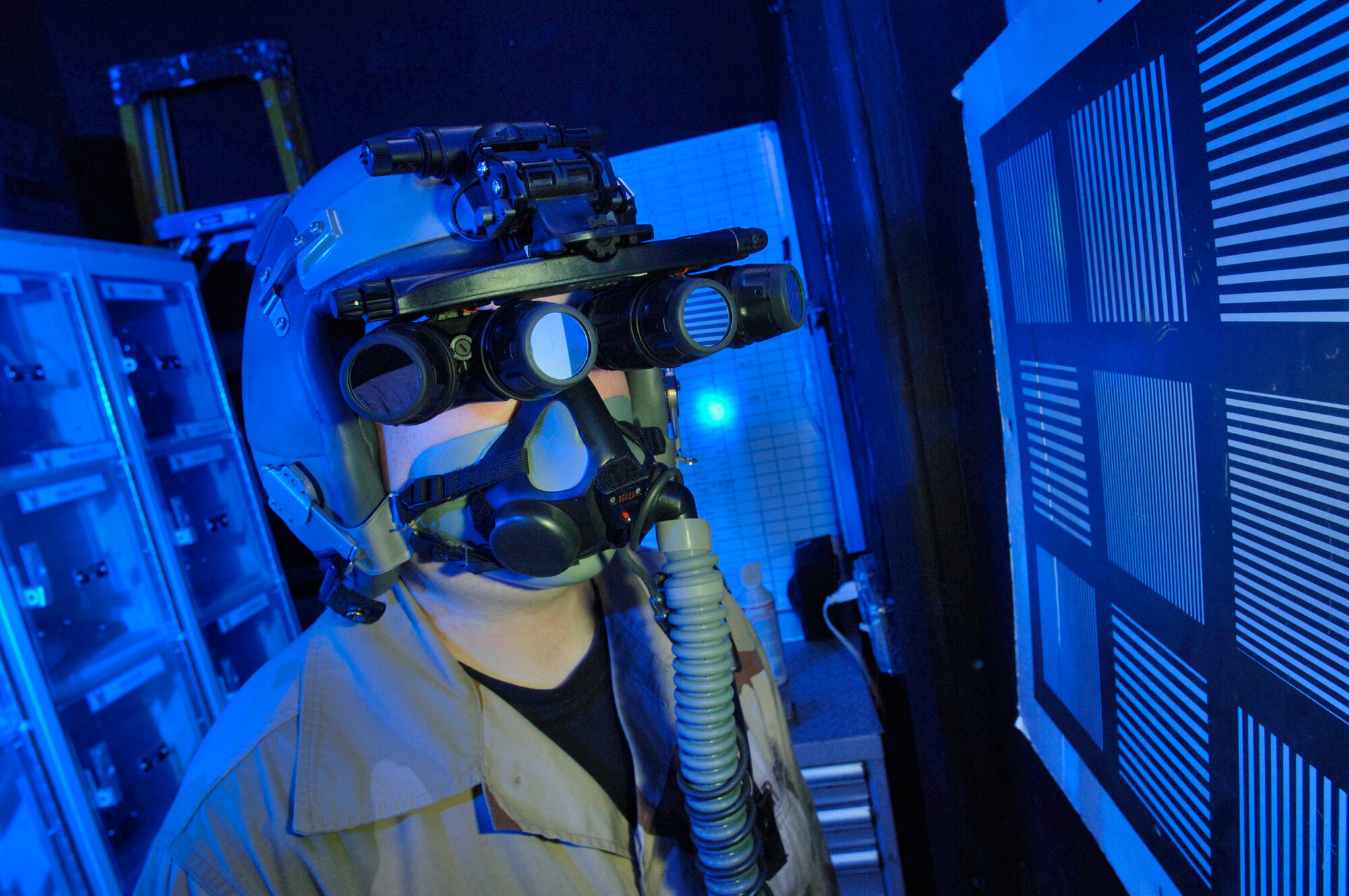 Tech. Sgt. Matthew Freeman does an operational check of panoramic night vision goggles Monday, March 6, 2006, at a deployed location. The 355th Expeditionary Fighter Squadron was chosen for the goggles first operational use because of the low-altitude mission of the unit's A-10 Thunderbolt IIs. (U.S. Air Force photo illustration/Master Sgt. Lance Cheung)