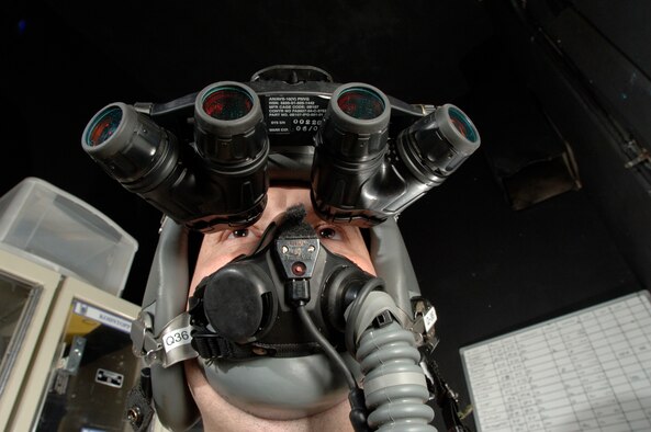 Tech. Sgt. Matthew Freeman does an operational check of panoramic night vision goggles Monday, March, 6, 2006.  The new goggles give pilots a 90-degree view.   The 355th Expeditionary Fighter Squadron was chosen for the first operational use of the $65,000 devices because of the low-altitude mission of the unit's A-10 Thunderbolt II aircraft. Adjustment of the panoramic goggles is simplified with the use of snap-on diopter lenses.  These lenses allow easy front-focus adjustment before and during flight.  Sergeant Freeman is from of Tucson, Ariz., and deployed from Eielson Air Force Base, Alaska. (U.S. Air Force photo/Master Sgt. Lance Cheung) 