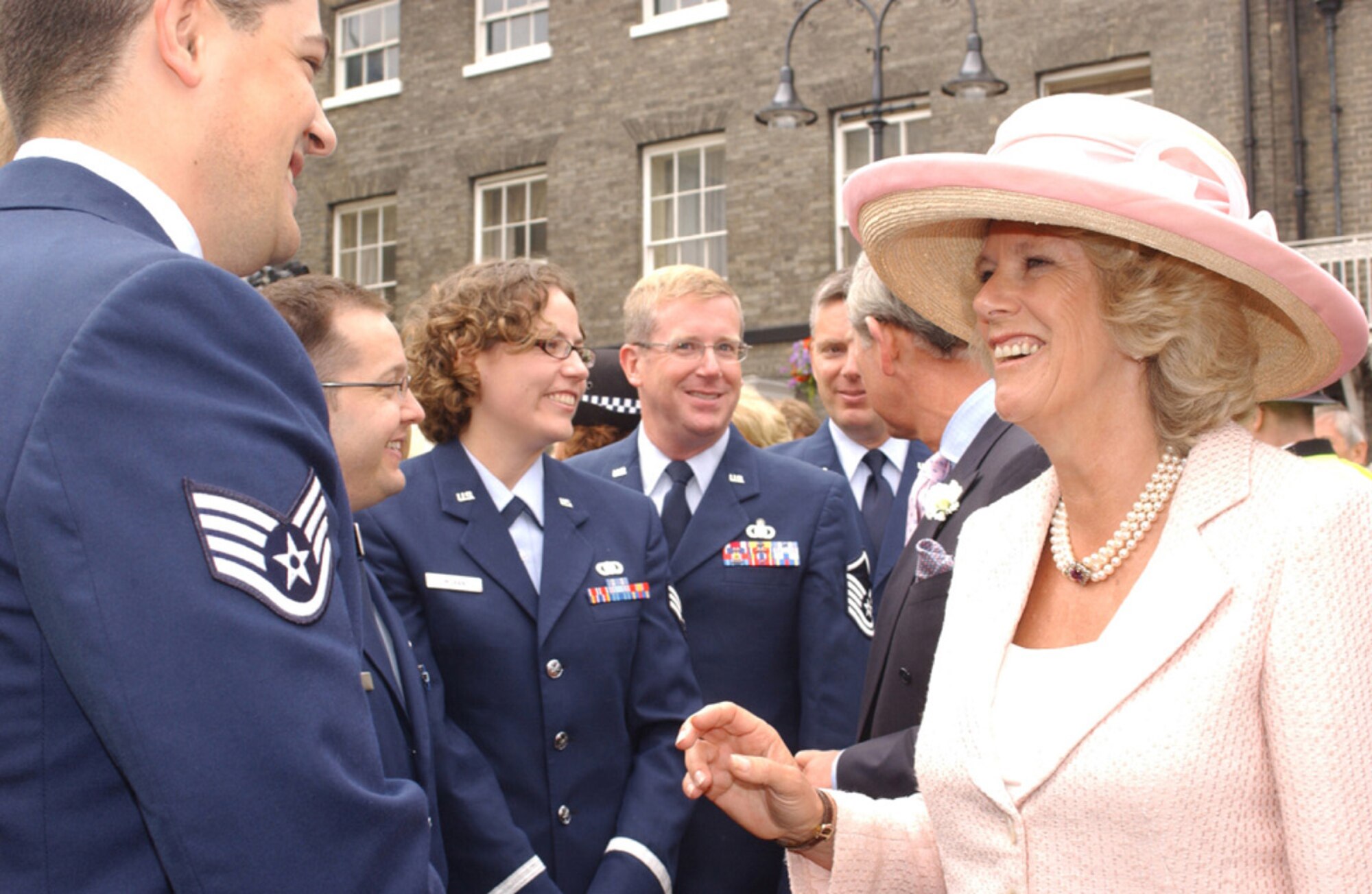 ROYAL AIR FORCE MILDENHALL, England (USAFENS) -- The members of the U.S. Air Forces in Europe Band's Brass Quintet met the Prince of Wales and the Duchess of Cornwall after the official ceremony for the completion of the Millennium Tower Project at St. Edmundsbury Cathedral in Bury St. Edmunds, England, July 22. The Brass Quintet performed, at the invitation of the Very Reverend Dean Atwell, Dean of St. Edmundsbury Cathedral, on Angel Hill outside the cathedral and in the historic Abbey gardens during the celebrations. (Photo by Staff Sgt. Valerie Smith)