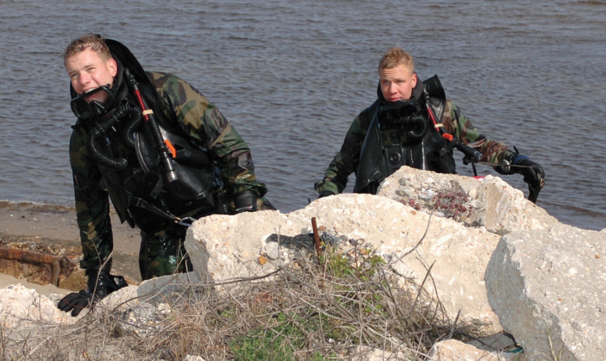 Airman 1st Class Josh Welch and Staff Sgt. Brian Enslev, Combat Dive Course students, reach the shore after a closed circuit dive. (U.S. Air Force photo/Chrissy Cuttita) 