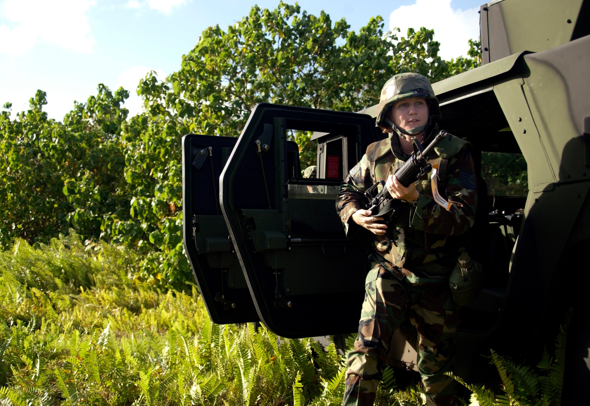 Tech. Sgt. Melissa Cervera participates in convoy and weapons familiarization training during the Guam Initial Readiness Response Exercise, or GIRRE, Tuesday, March 14, 2006. The GIRRE is an annual island-wide exercise between Andersen Air Force Base and Naval Marianas to train on war plan deployments and joint disaster response skills. During the GIRRE, 300 Air Expeditionary Force Airmen will participate under conditions they may see when deployed. The mission of this exercise is readiness and to prepare AEF Airmen with skills they can use to keep alive downrange while working with Navy and Government of Guam agencies on disaster response to save lives at home. (U.S. Air Force photo/Airman 1st Class Miranda Moorer)