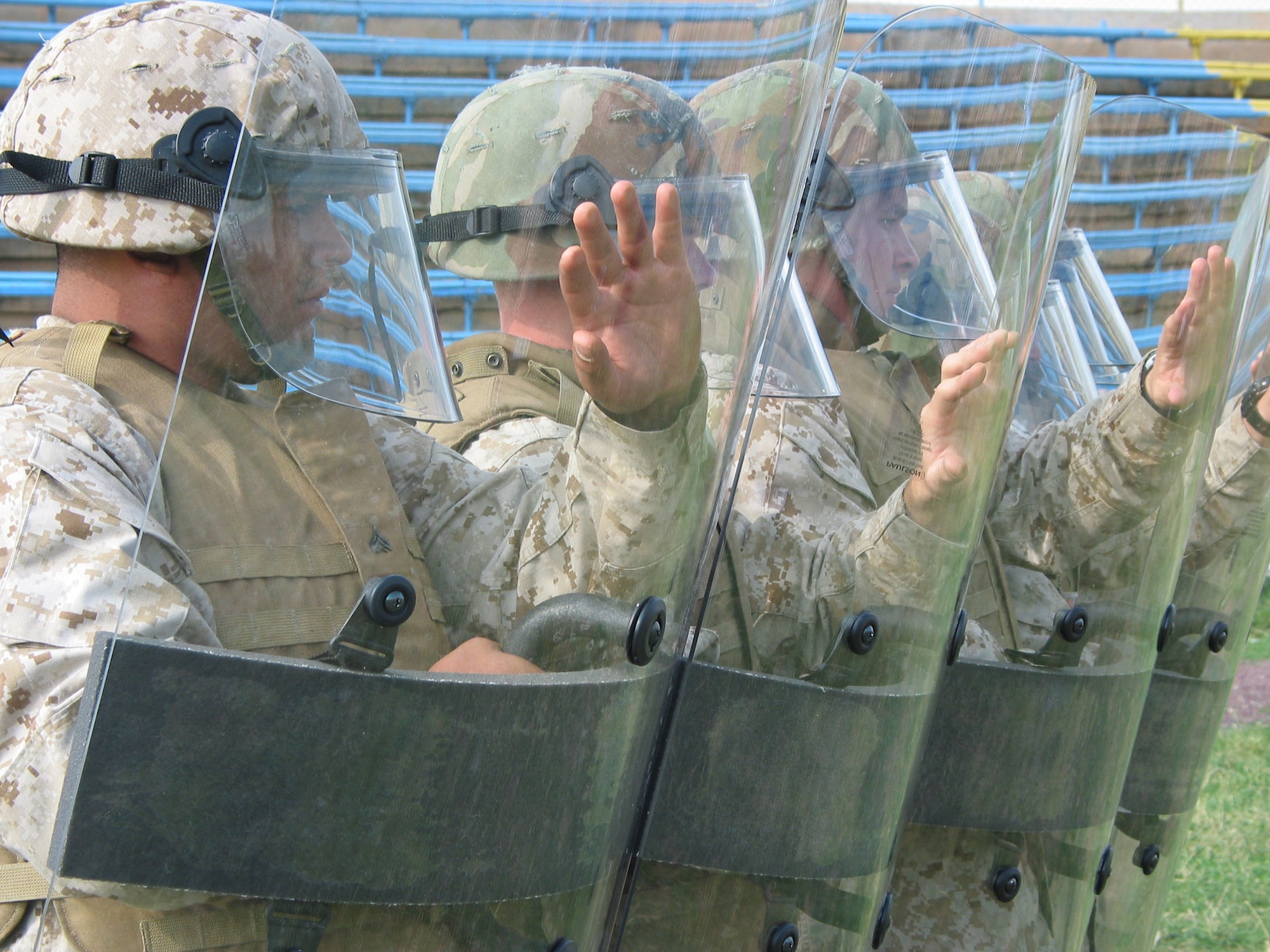 TBILISI, Republic of Georgia (USAFENS) -- Marines with the 4th Light Armored Reconnaissance Battalion demonstrate riot control techniques for members of the Georgian army during the RESCUER/MEDCEUR 2005 exercise at Vaziani military base here. (Photo by Erin Zagursky)