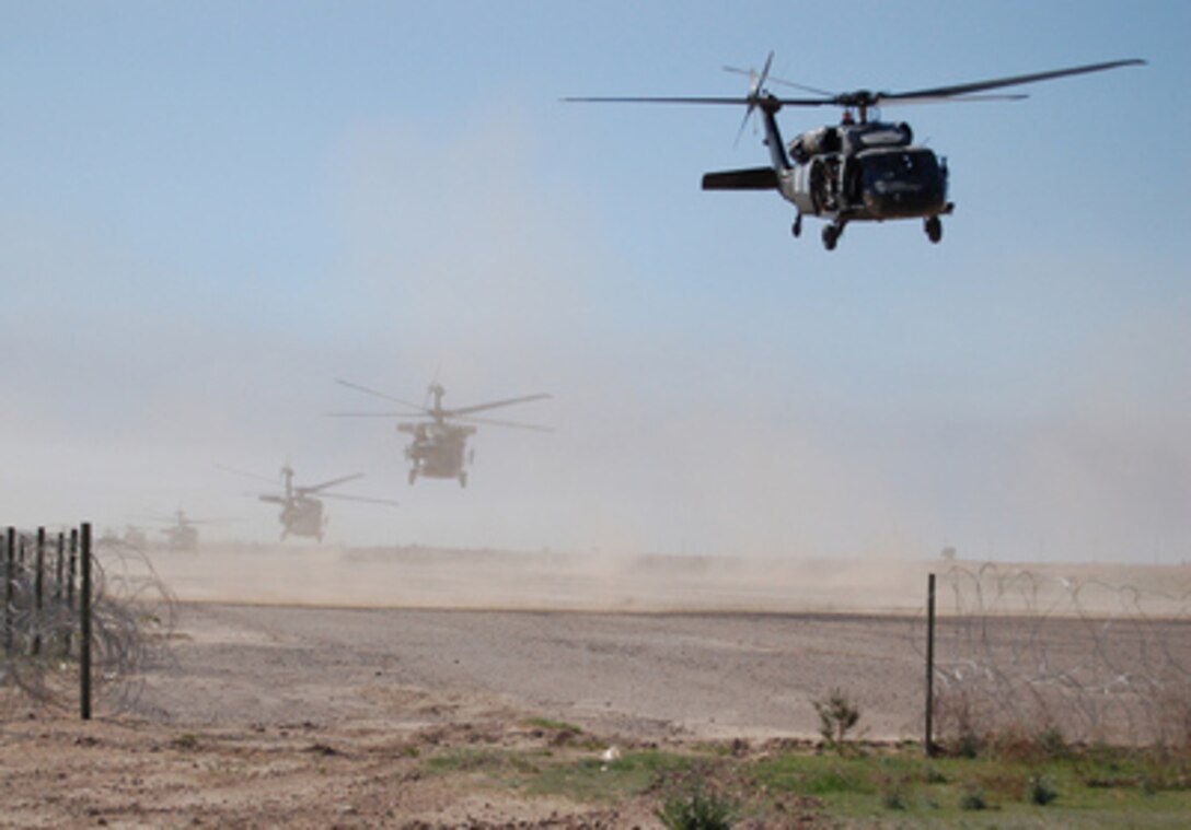 U.S. Army UH-60 Black Hawk helicopters lift off from Forward Operating Base Remagen, Iraq, for Operation Swarmer on March 16, 2006. Soldiers from the Iraqi Army's 1st Brigade, 4th Division and the U.S. Army's 101st Airborne Division's 3rd Brigade Combat Team are taking part in the combined air assault operation to clear the area northeast of Samarra of suspected insurgents. 