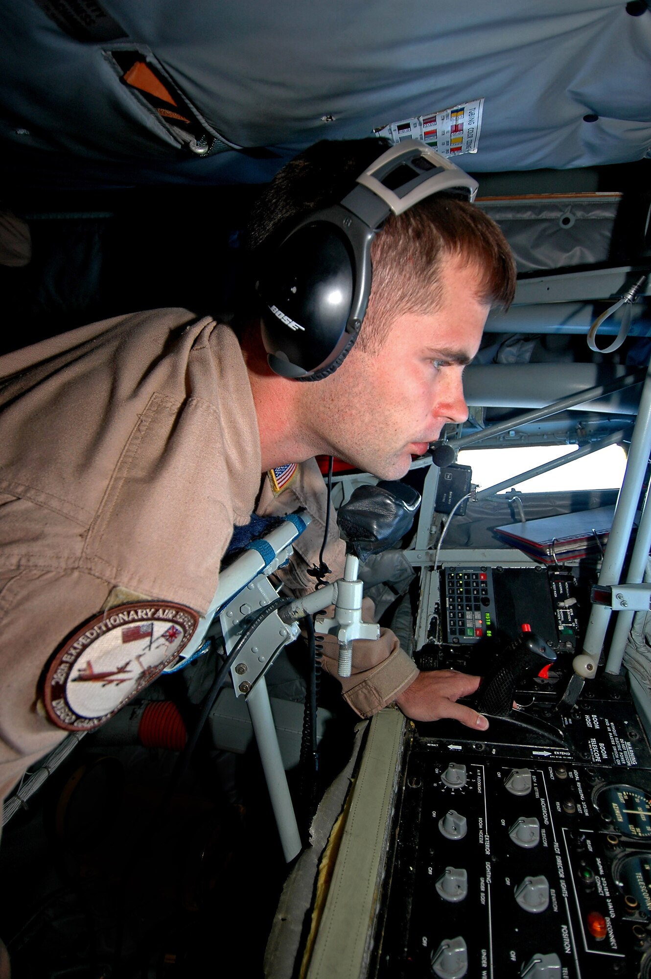 Airman 1st Class Ben Davis prepares to fuel a B-52 Stratofortress over the Indian Ocean. The B-52s provide close air support to troops on the ground in Afghanistan. Airman Davis is a boom operator with the 28th Expeditionary Air Refueling Squadron. (U.S. Air Force photo/Staff Sgt. Doug Nicodemus)
