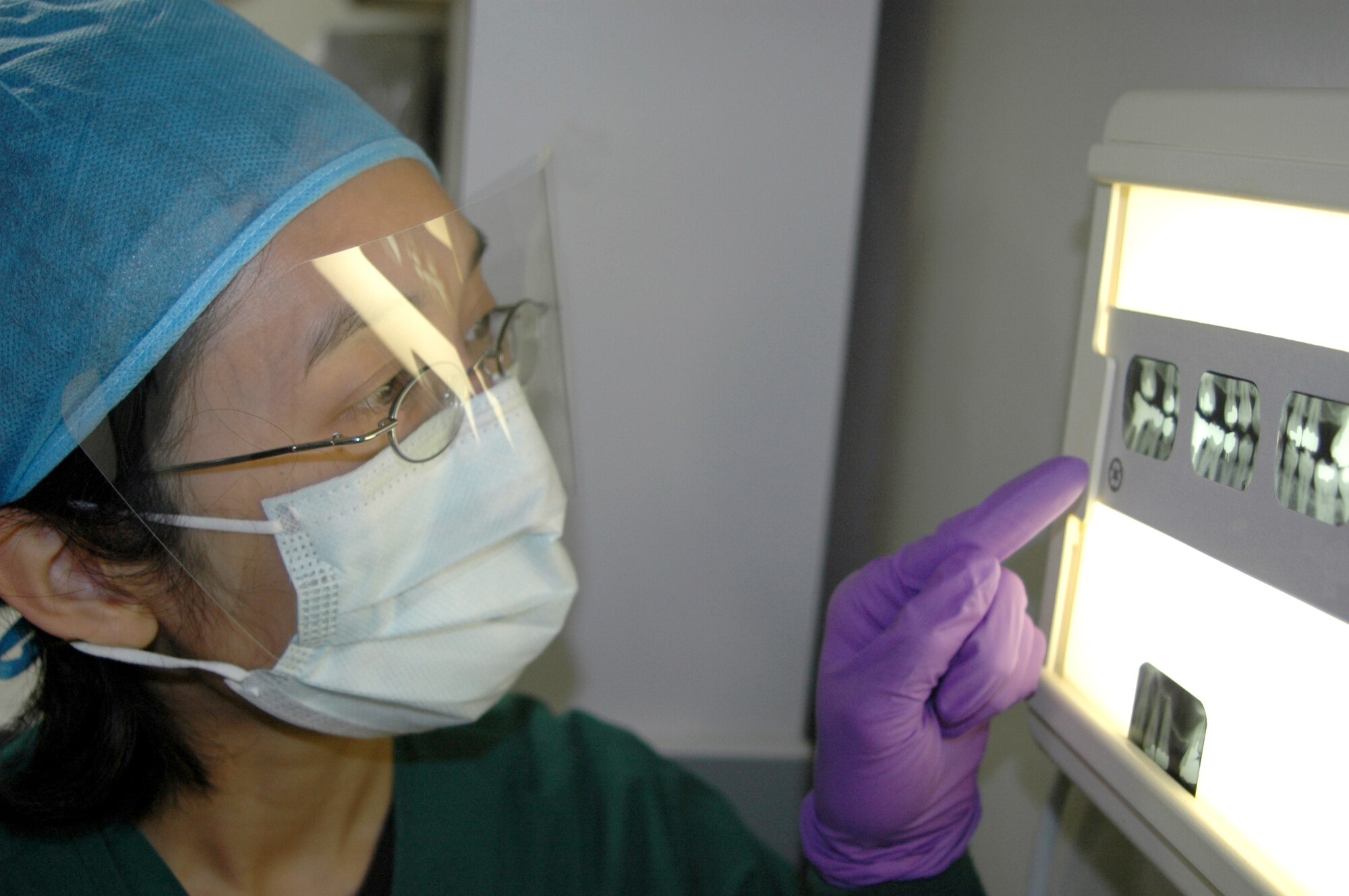 Major (Dr.) Elizabeth Kutner reviews a patient's X-rays at Anderson Air Force Base, Guam. Doctor Kutner is a general dentist with 36th Medical Group dental clinic (U.S. Air Force photo/Tech. Sgt. Bryan Gatewood)


 

