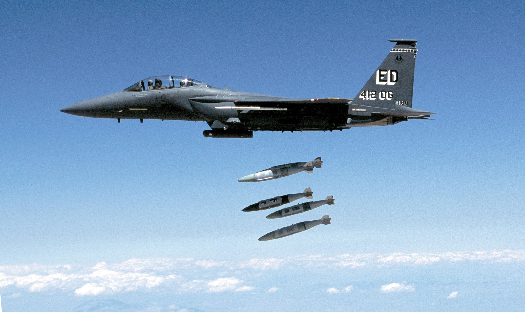 Four 2,000-pound Joint Direct Attack Munitions are released from an F-15E during a developmental test at Edwards Air Force Base in 2002. JDAM is known as the warfighter's weapon of choice because of its accuracy, reliability and low cost. More than 15,000 JDAMs have been used in combat since its debut in 1999 during Operation Allied Force. (Courtesy Photo)