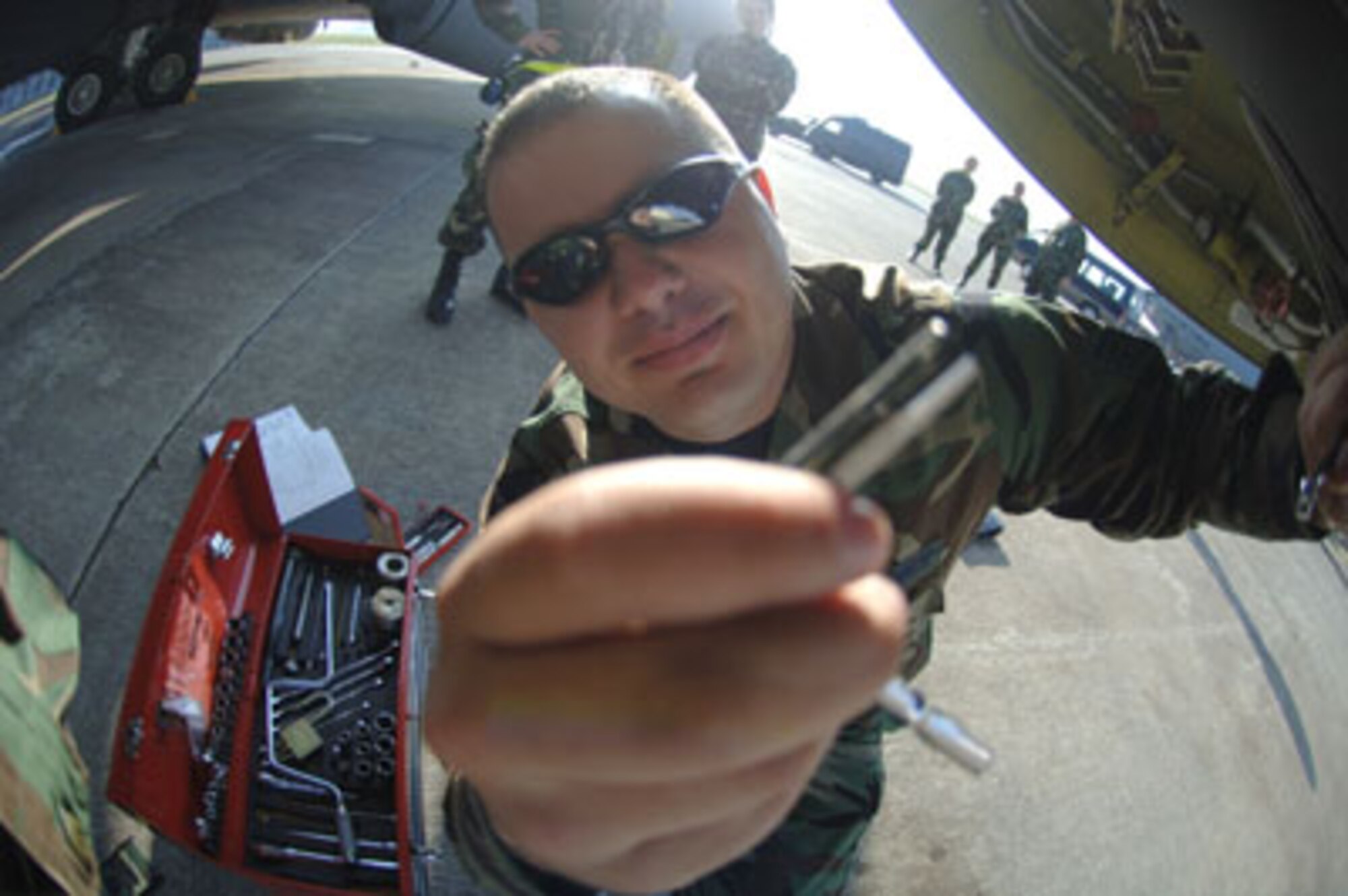 U.S Air Force Staff Sgt. Joe Simpson (foreground), a jet engine mechanic with the 940th Air Refueling Wing, Beale Air Force Base, Calif., repairs a housing filter on a KC-135R an active duty aircraft assigned to RAF Mildenhall, England here Thursday December 22, 2005 Incirlik AB, Turkey.
(U.S Air Force Photo by Senior Airman Larry E. Reid Jr.)

