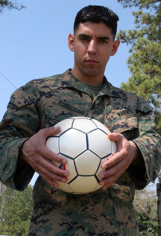 MARINE CORPS BASE CAMP LEJEUNE, N.C. - Cpl. Gibran H. Rodriguez, 22, a radio operator assigned to II Marine Expeditionary Force Headquarters Group, II MEF, and a former professional soccer player poses here March 17. The Aurora, Ill., native, played professional soccer in Mexico before joining the Marines in October 2003. After recently completing a year-long deployment to Iraq, Rodriguez is aiming once again for his soccer dreams and aspirations. (Marine Corps photo by Cpl. Ruben D. Maestre)