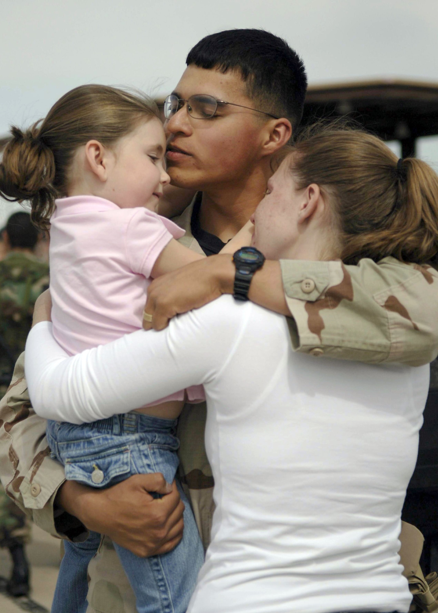 Senior Airman Justin Gonzales reunites with his family at Davis-Monthan Air Force Base, Ariz., Friday, March 17, 2006, as he returns from his deployment. The 355th Security Forces Squadron was deployed to Camp Bucca, Iraq, for nine months in support of Operation Iraqi Freedom. (U.S. Air Force photo/Senior Airman Christina Ponte)
 
