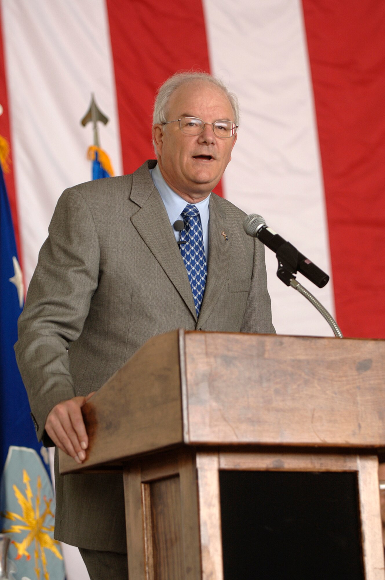 Secretary of the Air Force Michael W. Wynne speaks to Airmen about Air Force Smart Operations 21 at Andersen Air Force Base, Guam, Monday, March 20, 2006.  Secretary Wynne is responsible for organizing, training, equipping and providing for the welfare of nearly 370,000 men and women on active duty, 180,000 members of the Air National Guard and the Air Force Reserve, 160,000 civilians, and their families. (U.S. Air Force photo/Staff Sgt. Bennie J. Davis III)