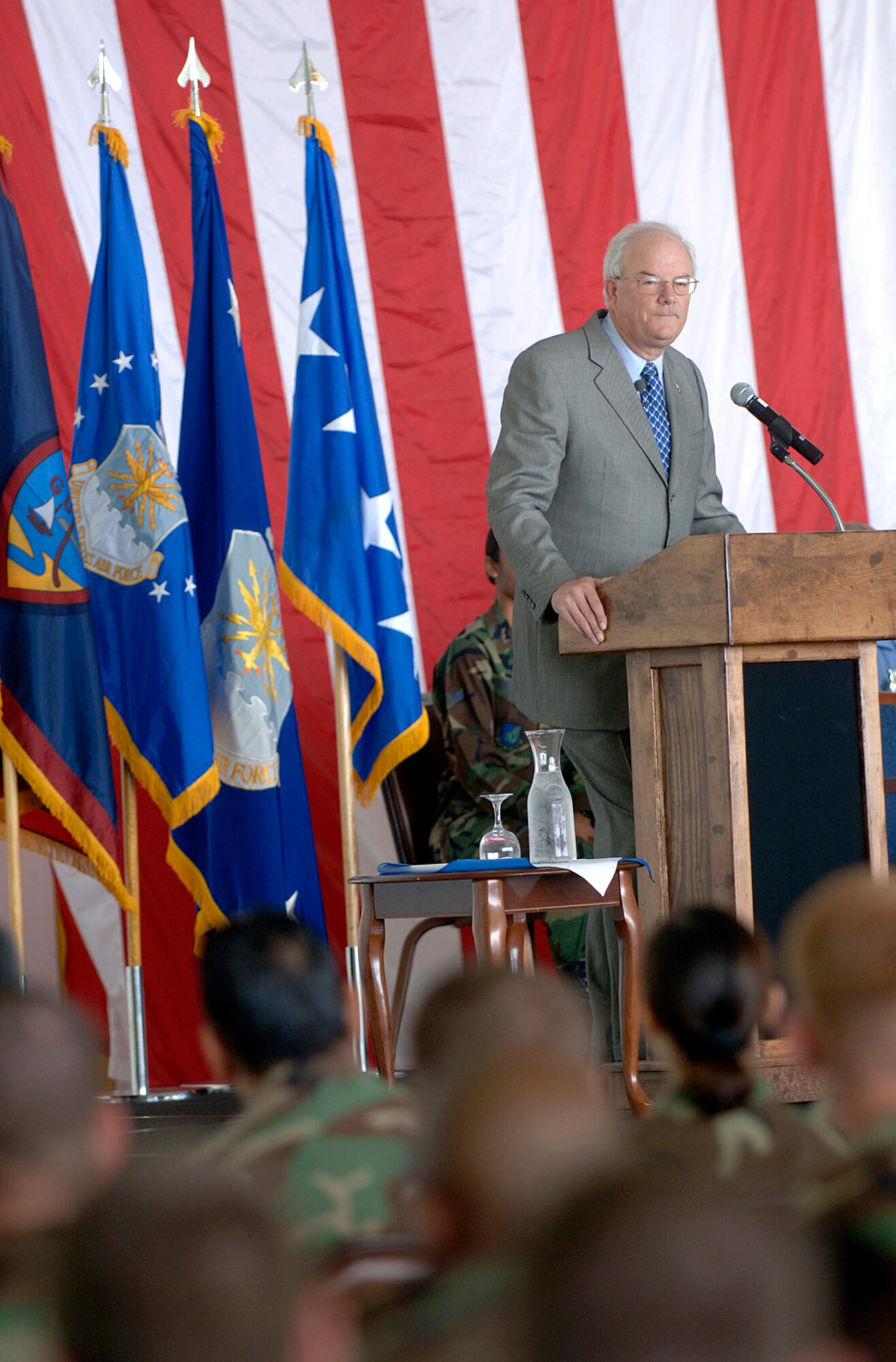 Secretary of the Air Force Michael W. Wynne speaks to Airmen about Air Force Smart Operations 21 at Andersen Air Force Base, Guam, Monday, March 20, 2006.  Secretary Wynne is responsible for organizing, training, equipping and providing for the welfare of nearly 370,000 men and women on active duty, 180,000 members of the Air National Guard and the Air Force Reserve, 160,000 civilians, and their families. (U.S. Air Force photo/Staff Sgt. Bennie J. Davis III)
