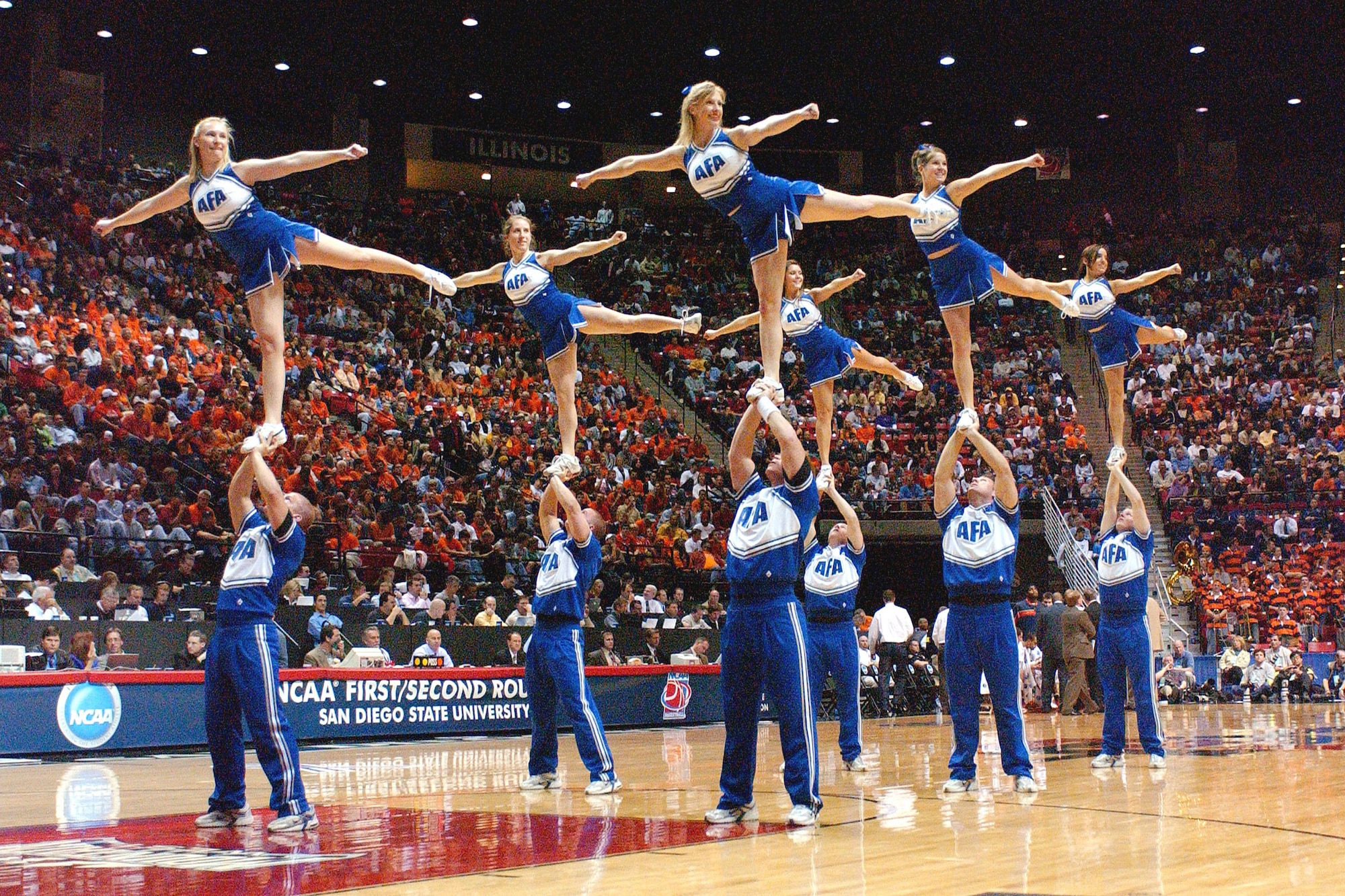 Air Force cheerleaders entertain the crowd at Cox Arena in San Diego, Calif., during a break in the NCAA Tournament game Thursday, March 16, 2006, between the Falcons and Illinois. (U.S. Air Force photo/Danny Meyer) 

