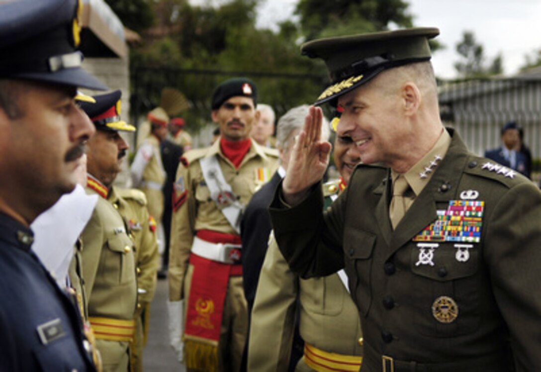 Chairman of the Joint Chiefs of Staff Gen. Peter Pace, U.S. Marine Corps, salutes as he is introduced to a member of the Pakistani Joint Chiefs at the Joint Forces Command in Islamabad, Pakistan, on Mar. 20, 2006. Pace is in Islamabad to meet with his Pakistani counterpart Gen. Ehsan Ul Haq. Pace will later visit with American servicemembers who deployed to Pakistan for humanitarian relief efforts following the October 2005 earthquake near Muzaffarabad that killed an estimated 75,000 Pakistanis. 