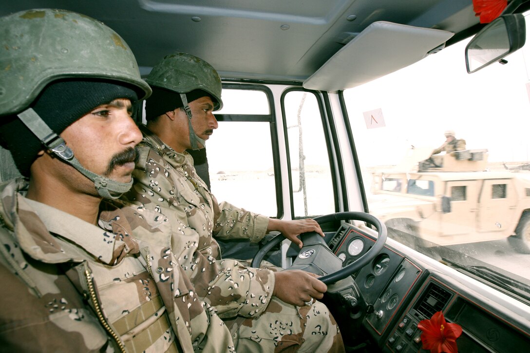 Iraqi soldiers practice navigating during a recent exercise at Al Asad Air Base, March 20, 2006. More than 120 soldiers from the Iraqi 8th Motor Transport Regiment are getting region-specific and refresher training from Marines here to prepare them for convoy operations in the dangerous Al Anbar Province. Motor transportation specialists with the Marines' Combat Logistics Battalion - 7 are training their Iraqi counterparts how to move troops and supplies throughout Iraq while facing improvised explosive devices, enemy ambushes and rough roads.