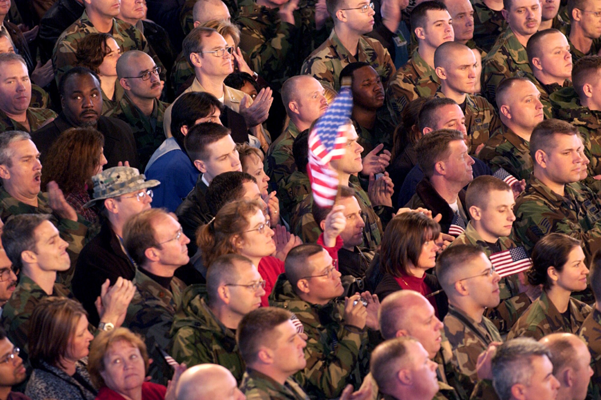 Members of the Scott community cheer as Vice President Dick Cheney rallies the troops Tuesday, March 21, 2006, during his visit to Scott Air Force Base, Ill.  (U.S. Air Force photo/Marvin Lynchard)