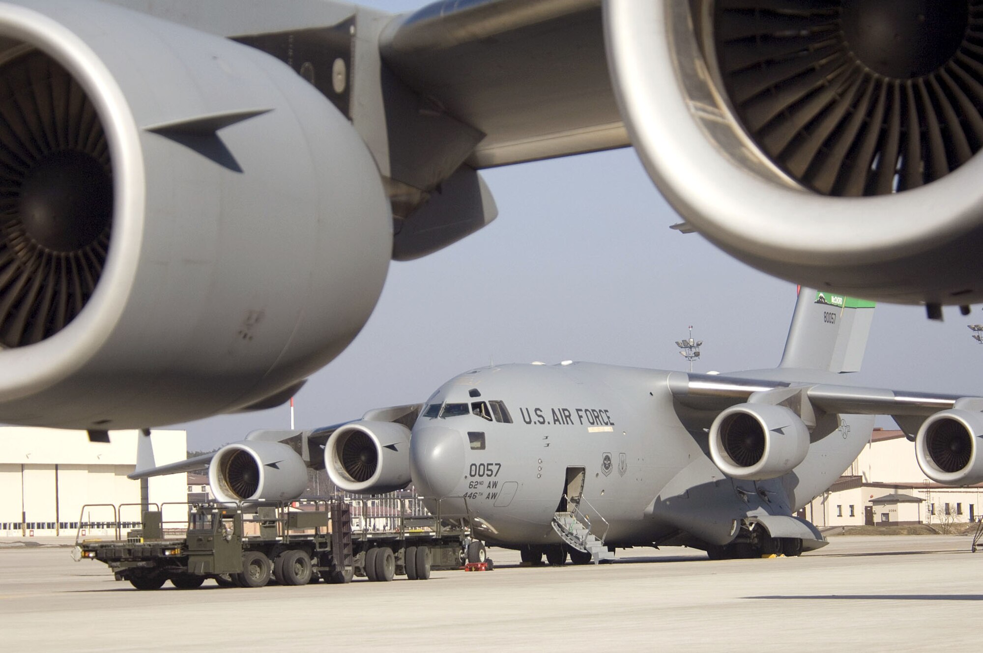A C-17 Globemaster III awaits loading on the parking ramp at Ramstein Air Base, Germany, on Sunday, March 19, 2006. The transport, from McChord Air Force Base, Wash., helps a fleet of Air Force cargo planes move troops and cargo from stateside bases to Iraq and Afghanistan. (U.S. Air Force photo/Master Sgt. John E. Lasky) 