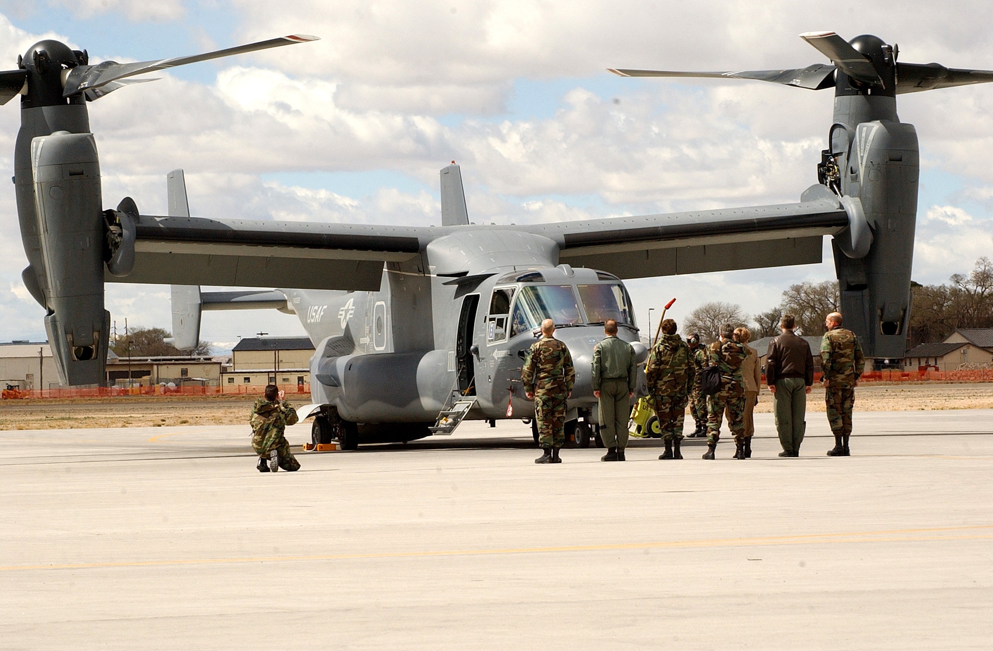 Airmen at Kirtland AFB, N.M., prepare to greet Lt. Gen. Michael W. Wooley, commander of the Air Force Special Operations Command.  General Wooley delivered the Air Force's first operational CV-22 Osprey to the 58th Special Operations Wing Monday, March 20, 2006. (U.S. Air Force photo/Staff Sgt. Markus Maier)

