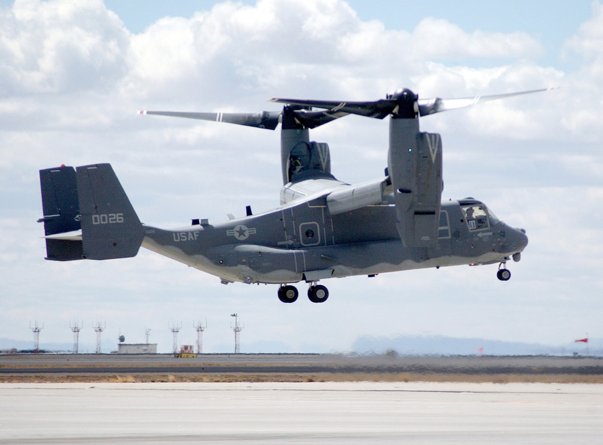 The Air Force's first operational CV-22 Osprey tilt-rotor aircraft hovers upon arrival at Kirtland Air Force Base, N.M., Monday, March 20, 2006.  The aircraft will be flown by Airmen with the 58th Special Operations Wing to train future Osprey pilots.  (U.S. Air Force photo/Staff Sgt. Markus Maier)