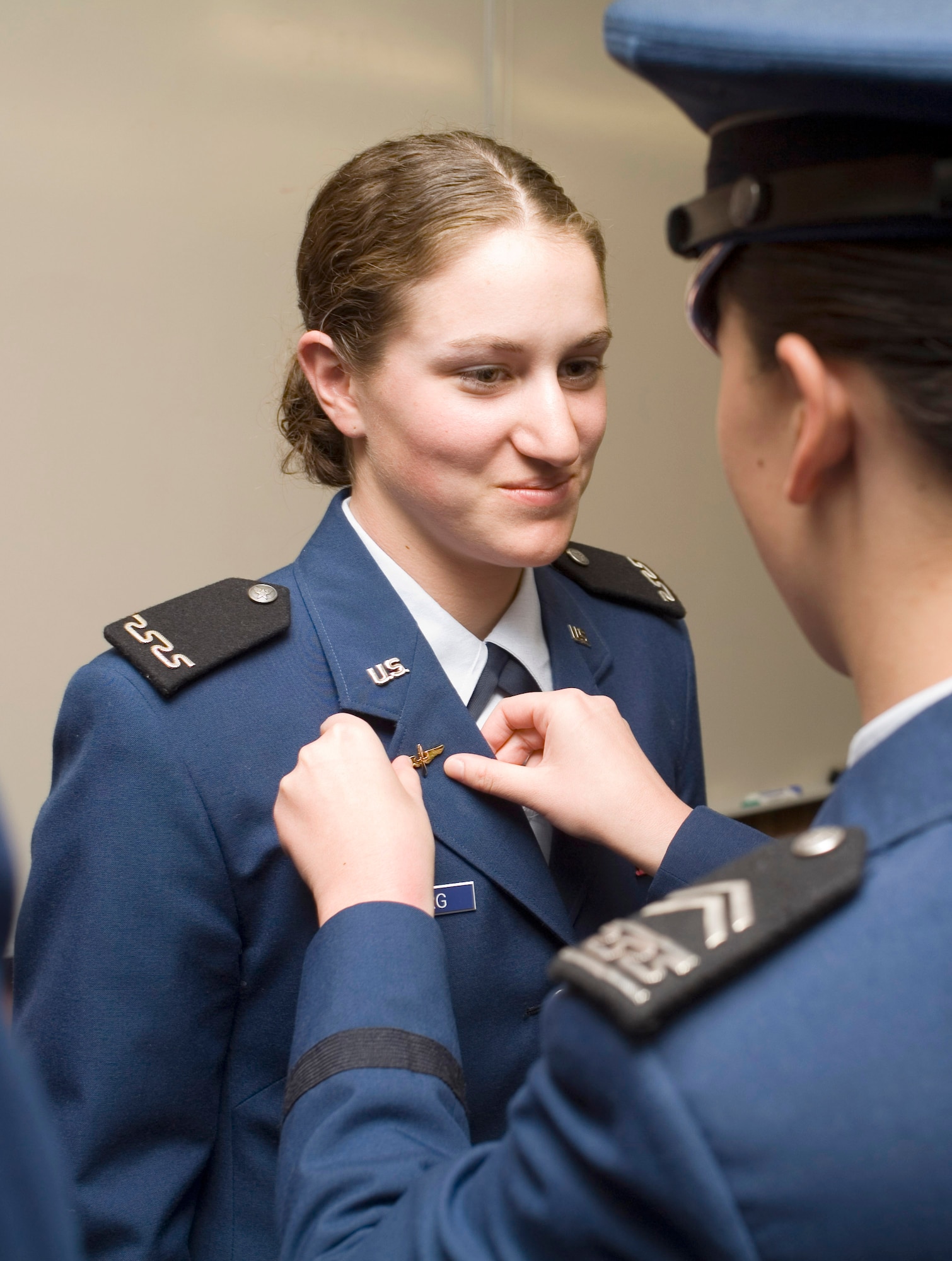 Cadet 4th Class Roberta Nitzberg of Cadet Squadron 8 receives her much-anticipated prop and wings during a formal ceremony Saturday, March 18, 2006, at the U.S. Air Force Academy, Colo. (U.S. Air Force photo/Eddie Kovsky) 


