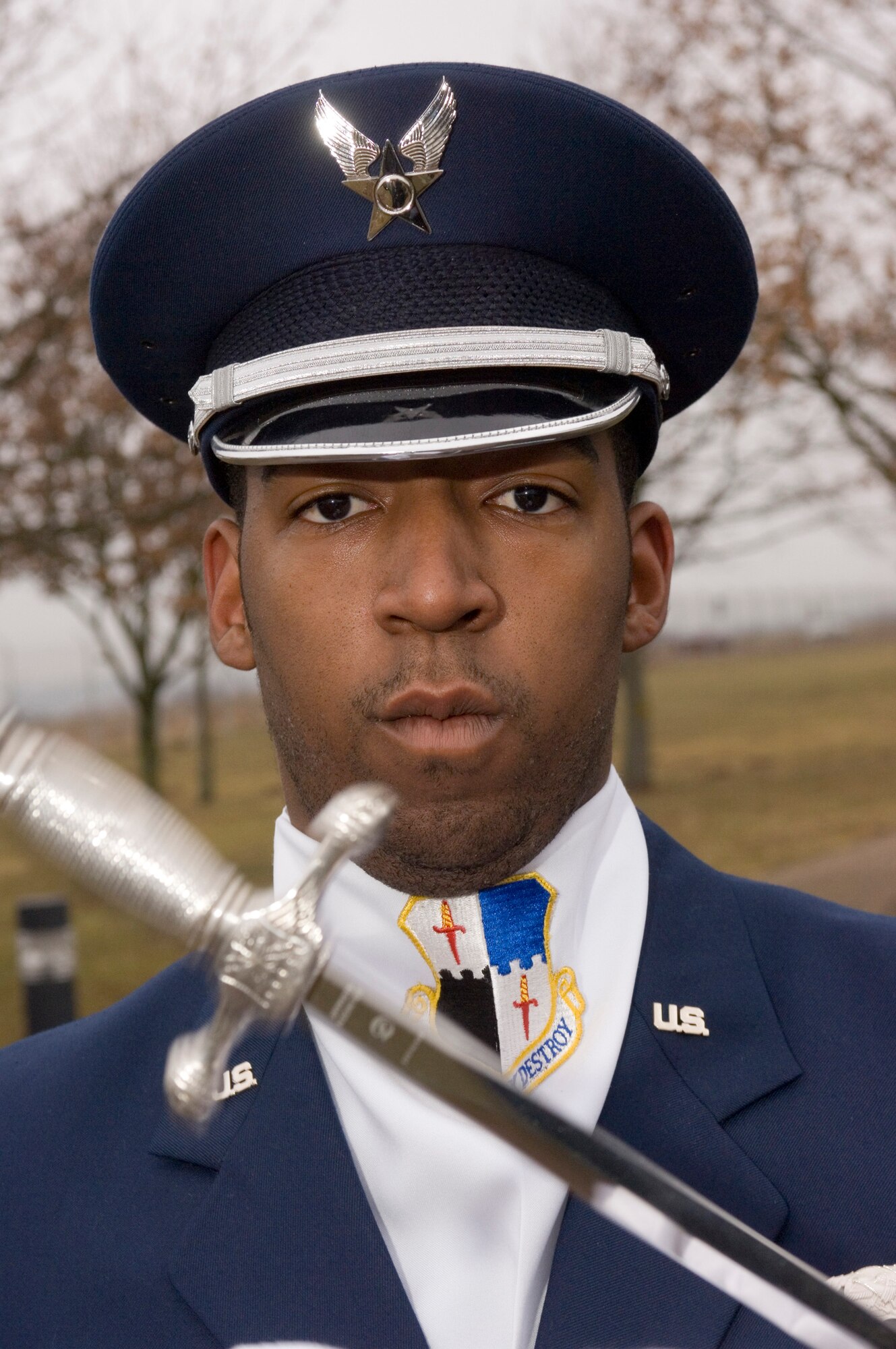 Senior Airman Bernard Price practices saber handling during practice at Spangdahlem Air Base, Germany, on Tuesday, March 21, 2006. Airman Price is a material control specialist with the 606th Air Control Squadron. (U.S. Air Force photo/Master Sgt. John E. Lasky) 