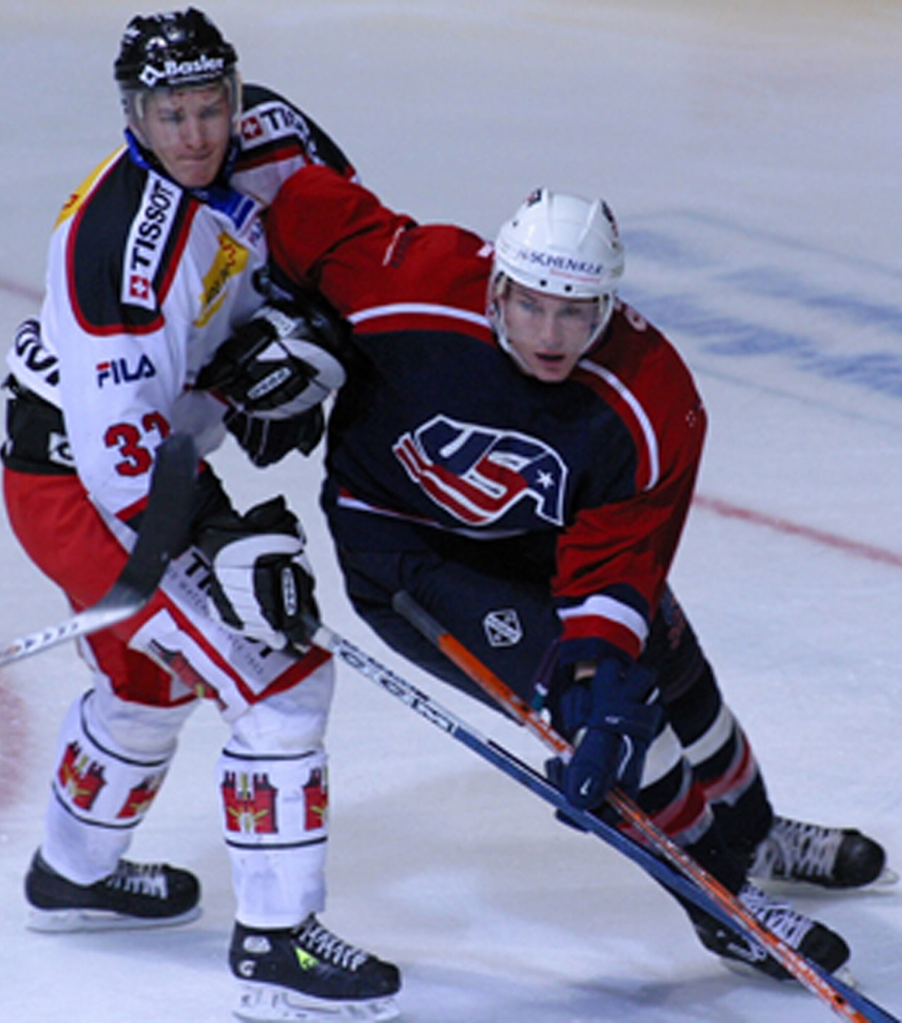 Lieutenant Gornick battles for the puck while playing for the Team USA hockey team.