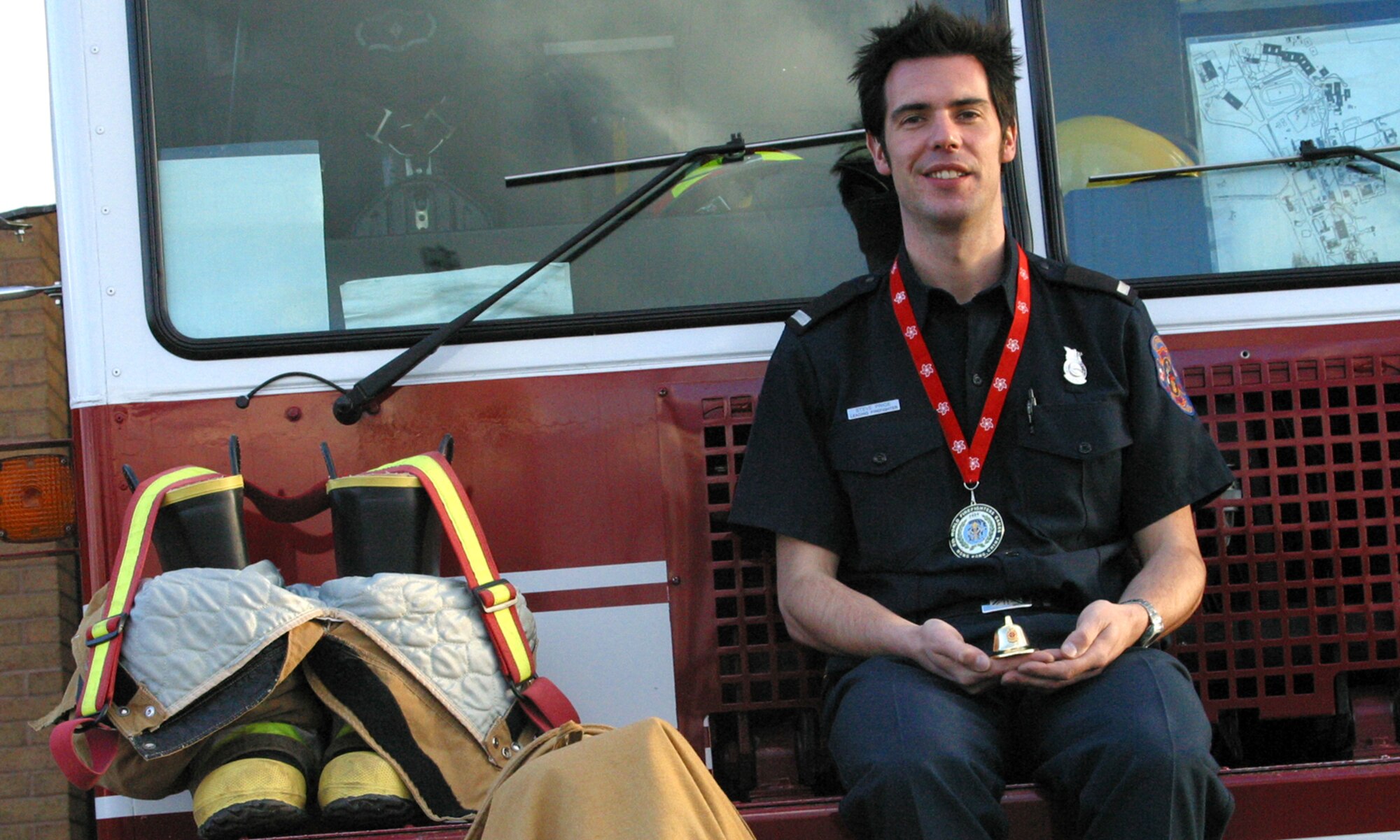 Lead Firefighter Steve Price displays the gold medal and firefighter’s hat he won at the 9th World Firefighter Games in Hong Kong. He won the gold in the indoor rowing event. More than 3,000 firefighters from 32 countries attended.
