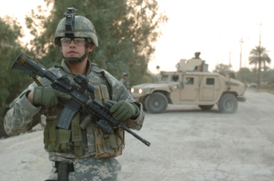Staff Sgt Calvin Newman maintains perimeter security for his fellow soldiers while on patrol in East Baghdad, Iraq, on March 15, 2006. Newman is attached to the U.S. Armyís 506th Regimental Combat Team, 101st Airborne Division. 