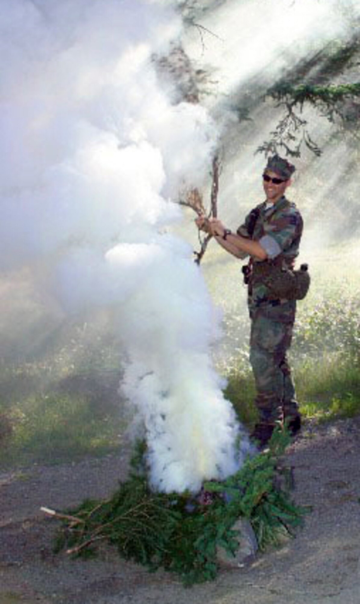 NASA astronaut candidate James Dutton Jr. builds a signal fire during 2004 ASCAN land survival training in the wilderness of Maine. (NASA courtesy image)