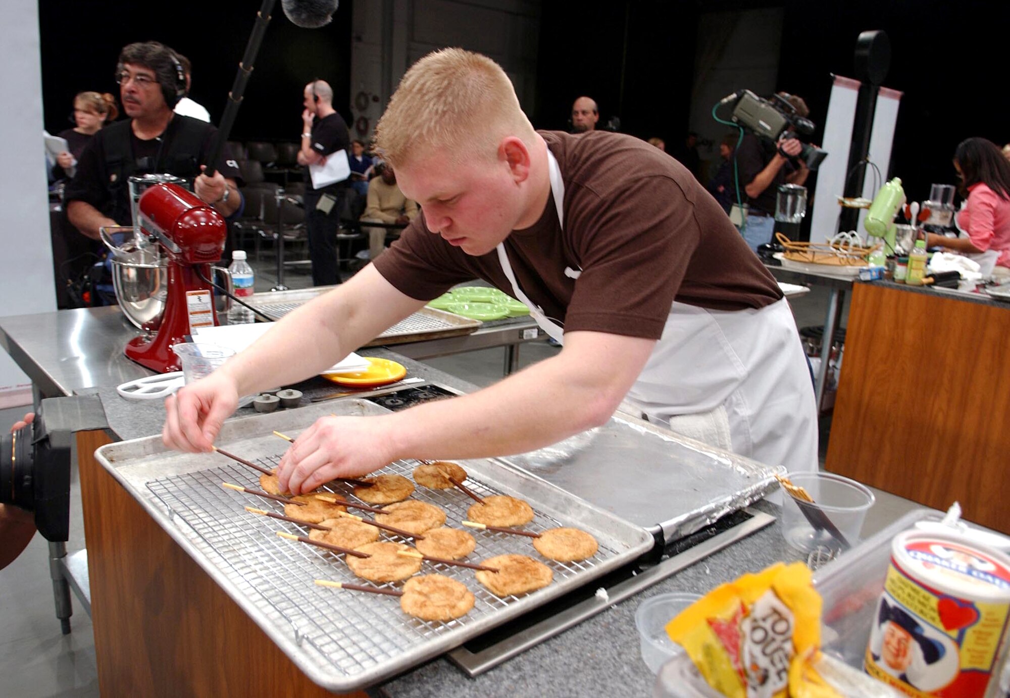 Senior Airman David Sutherland prepares his snickerdoodle pop cookies to compete against four others during the 2006 Food Network Cookie Challenge Monday, March 20 in Denver.  Airman Sutherland is a missile chef with the 741st Missile Squadron, Minot Air Force Base, N.D. (U.S. Air Force photo/Senior Airman Taylor Marr)