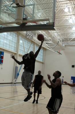 Benjamin Golstein of the 60th Services Squadron team is unable to block his opponent’s lay-up. (U.S. Air Force photo by Jennifer Brugman)