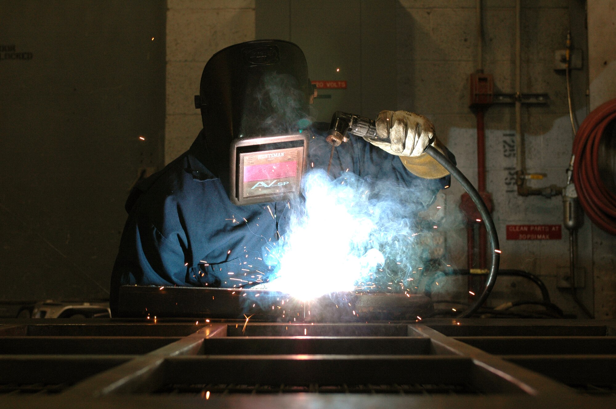 Mr. Michael Hale, a CEMIRT mechanic, welds a piece of equipment.  CEMIRT has a fully functional welding shop.  The shop gives them the advantage to fabricating and repairing parts and equipment without having to find off-base support.  The team also has the ability to send their welding equipment to off-base sites, which helps save time and money on different jobs. (U.S. Air Force photo by Staff Sgt. Raymond Hoy)