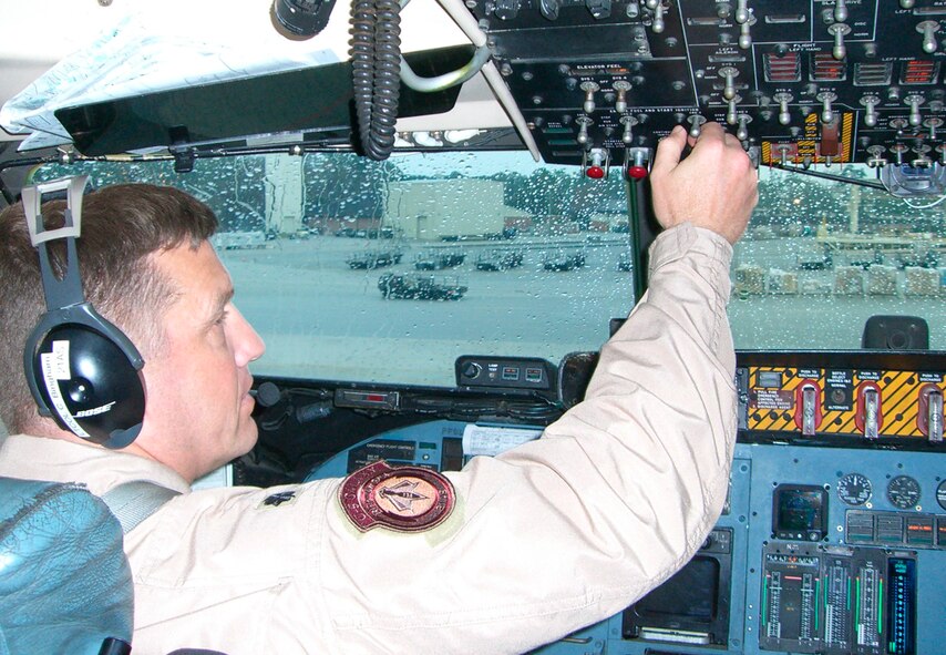 Lt. Col. Christopher Bingham, 21st Airlift Squadron operations officer, starts engines before taking off from Charleston Air Force Base, S.C. (U.S. Air Force photo by Capt. Mark Pasierb)  