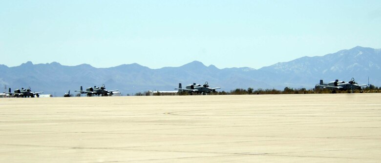 Four A-10 Thunderbolt IIs taxi down the runway as they arrive at Davis-Monthan Air Force Base, Ariz., Wednesday, March 22, 2006, to kick off the beginning of "Hawgsmoke 2006, the 30th anniversary of the Warthog. Hawgsmoke is a biennial bombing and tactical gunnery competition of the A-10, in which 20 squadrons worldwide come together to fly the Warthog and compete for the honor of the "Best of the Best" in ground attack and target destruction. (U.S. Air Force photo/Senior Airman Christina D. Ponte)
