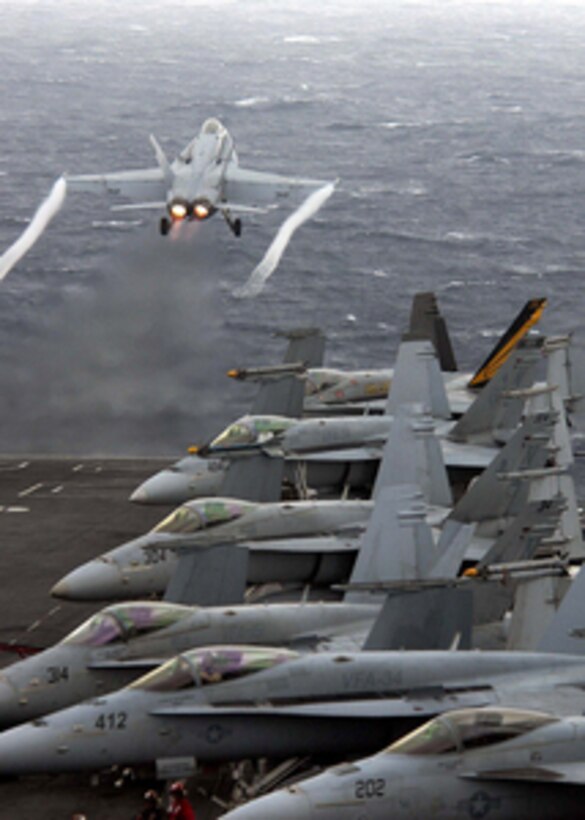 An F/A-18C Hornet aircraft is catapulted off the flight deck of the aircraft carrier USS Abraham Lincoln (CVN 72) during flight operations in the Pacific Ocean on March 22, 2006. The Hornet is attached to Strike Fighter Squadron 151. 