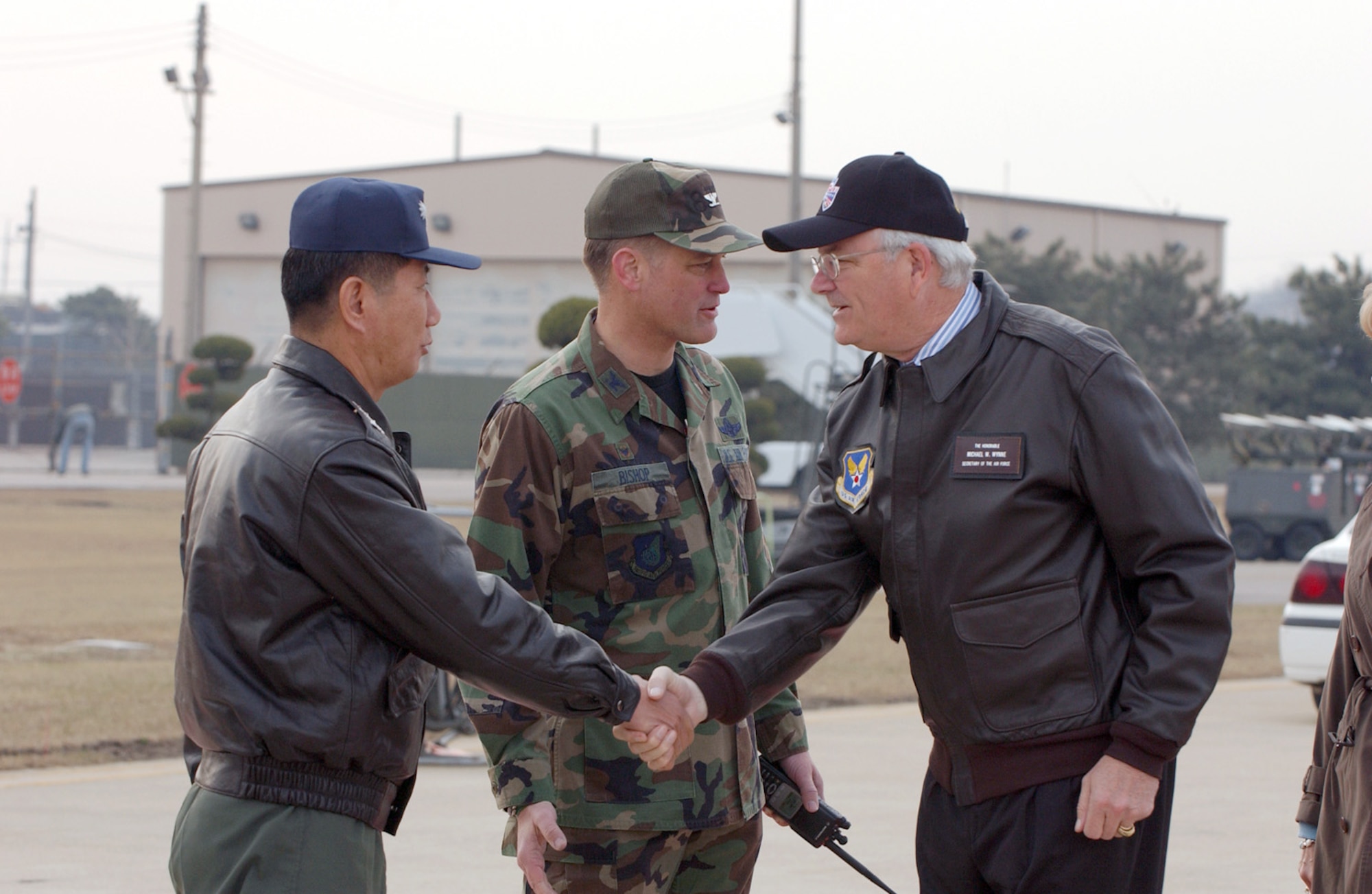 Secretary of the Air Force Michael W. Wynne (right) meets with Republic of Korea Air Force Col. Kim, Kwang Nam (left), 38th Fighter Group commander, together with Col. Brian Bishop (center), 8th Fighter Wing commander. Secretary Wynne visited Kunsan Air Base, South Korea, Wednesday, March 22, 2006.  (U.S. Air Force photo/Senior Airman Joshua DeMotts)