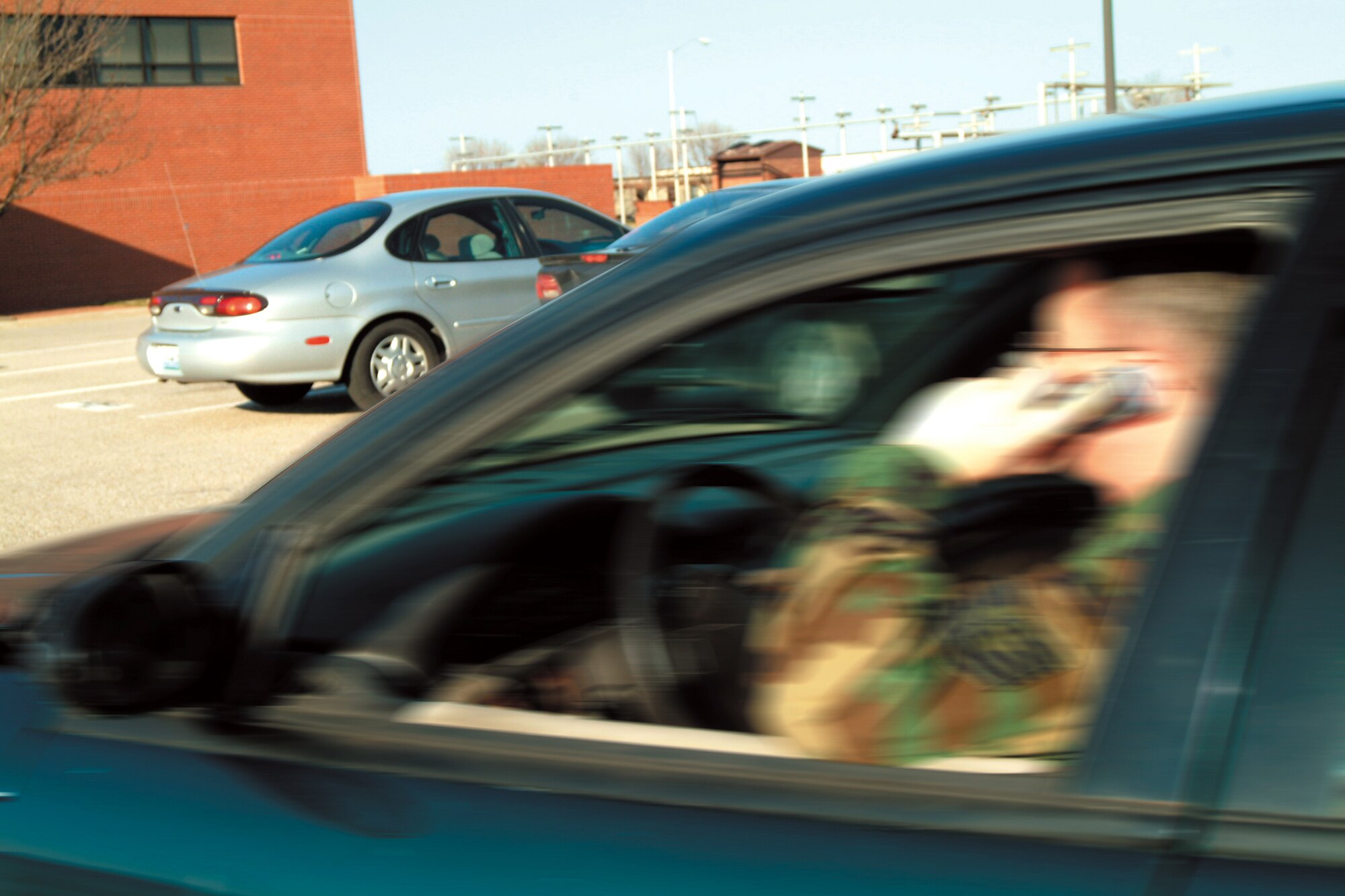 Unless using a hands-free device, cell phone use, while driving on Whiteman Air Force Base, Mo., is now a thing of the past.  Violators of the new regulation could lose base driving privileges.  (Photo illustration by Master Sgt. Bill Huntington)