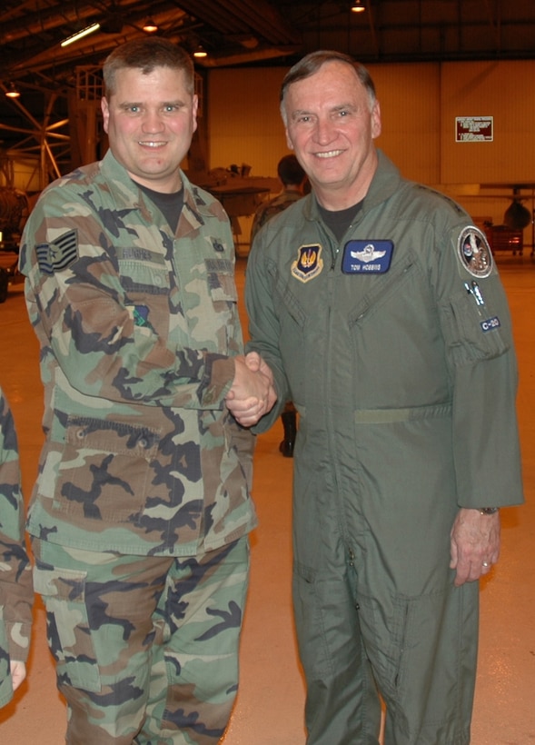 Tech. Sgt. Paul Hughes, Det. 4, Air Force News, poses with Gen. Tom Hobbins, U.S. Air Forces in Europe commander, during his visit Feb. 16 to RAF Lakenheath.