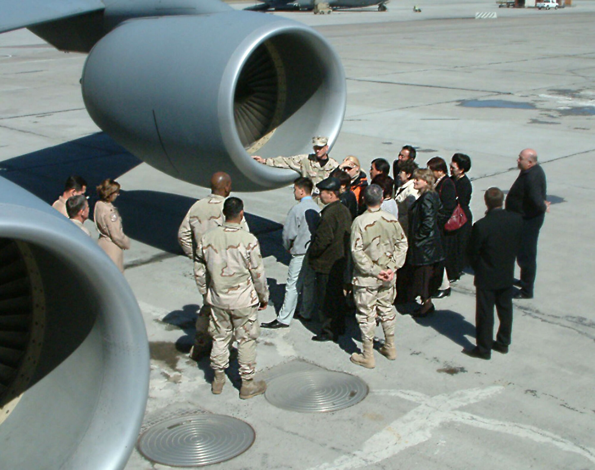 Col. Randy Kee and leaders from the 22nd Expeditionary Air Refueling Squadron explain the KC-135 Stratotanker mission to mayors of local villages invited to Manas Air Base, Kyrgyzstan, as part of a new outreach initiative Friday, March 24, 2006. Colonel Kee is the 376th Air Expeditionary Wing commander. (U.S. Air Force photo/Capt. James Bressendorff)
