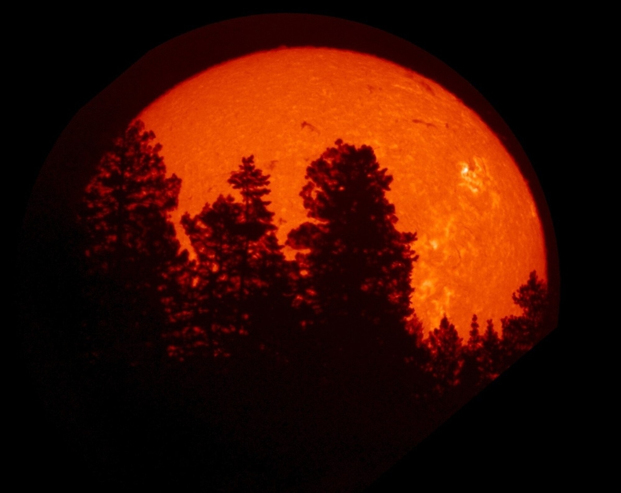 KIRTLAND AIR FORCE BASE, N.M. - Using the Air Force's Optical Solar Patrol Network telescope and viewed in the hydrogen-alpha spectral line, a sunrise at Sacramento Peak, N.M. is photographed. (Air Force photo)

