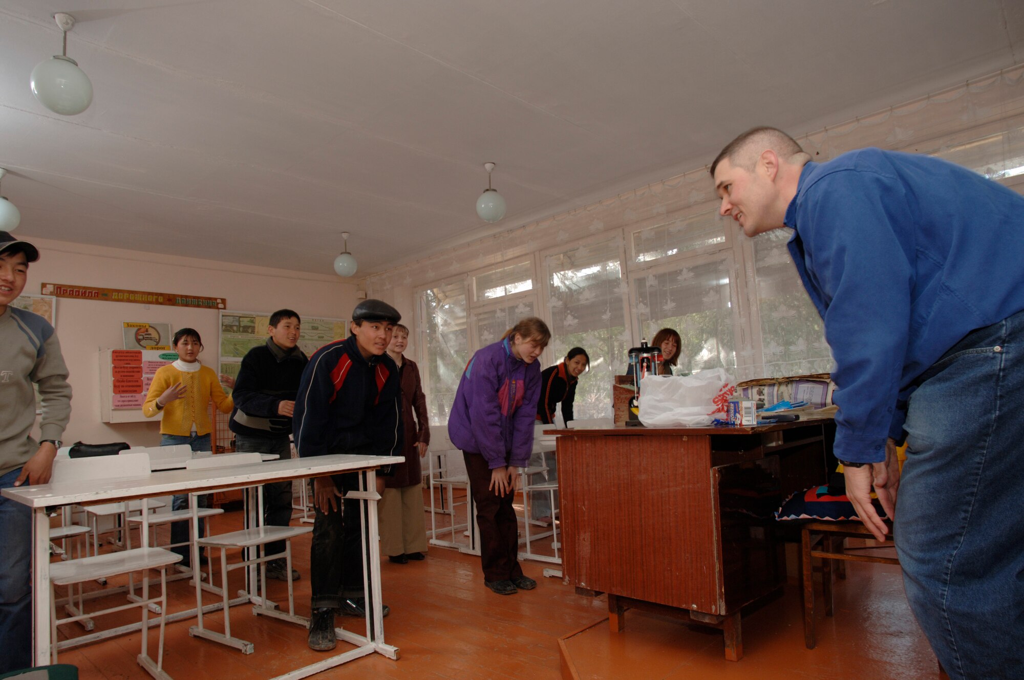 Capt. Arnold Sauve sings while tutoring students in English at Lyceum Vocational School in Kyrgyzstan. The in-residence vocational school is home to more than 200 local boys and girls, ages 14 to 18. Captain Sauve is deployed from Barksdale Air Force Base, La., to the 376th Expeditionary Medical Squadron at Manas Air Base. (U.S. Air Force photo/Master Sgt. Lance Cheung) 
