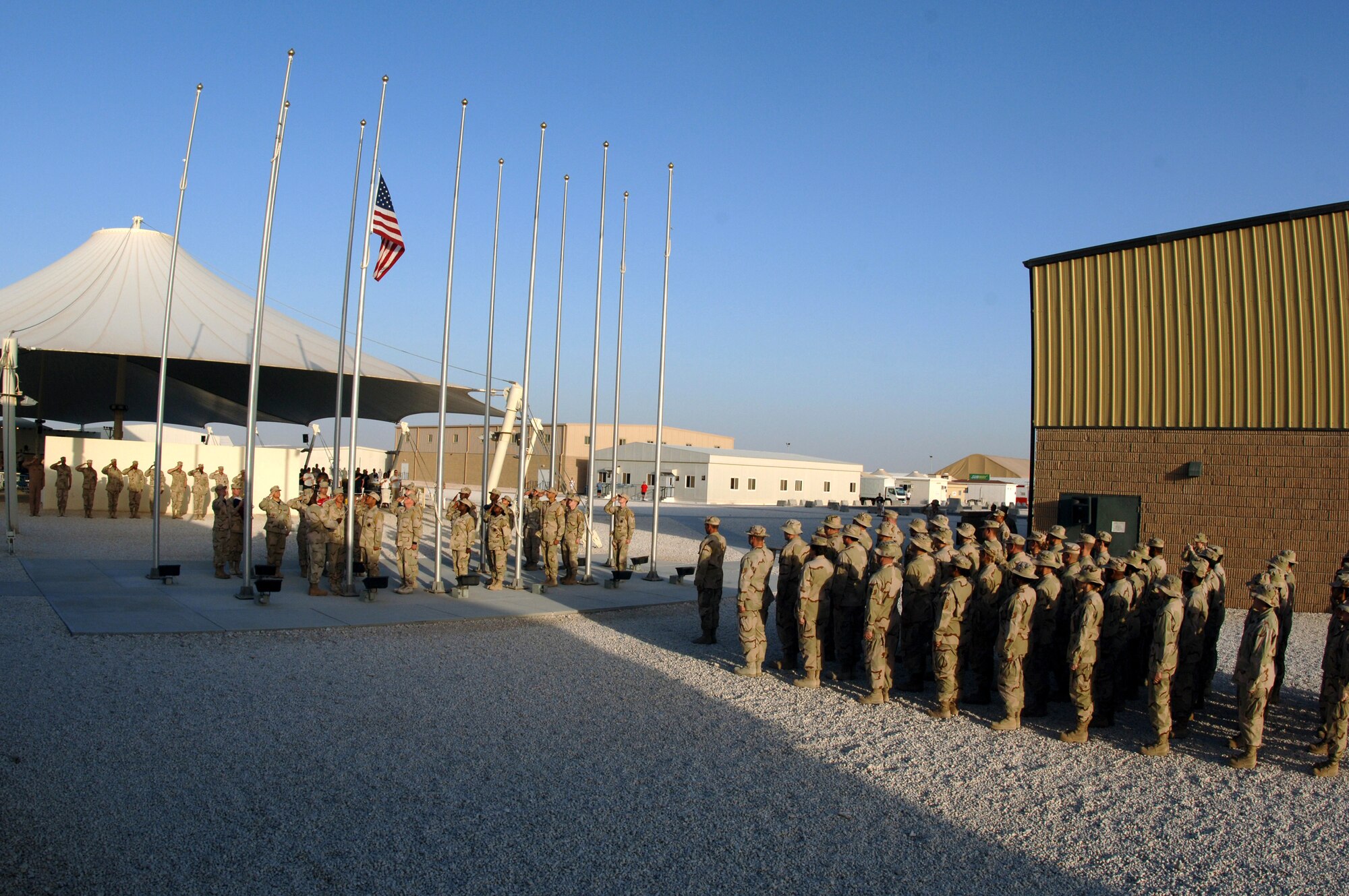 Airmen from the honor guard and the 379th Expeditionary Medical Group perform a retreat ceremony at a deployed location in Southwest Asia, Friday, March 24, 2006.  (U.S. Air Force photo/Staff Sgt. Joshua Strang)
 
